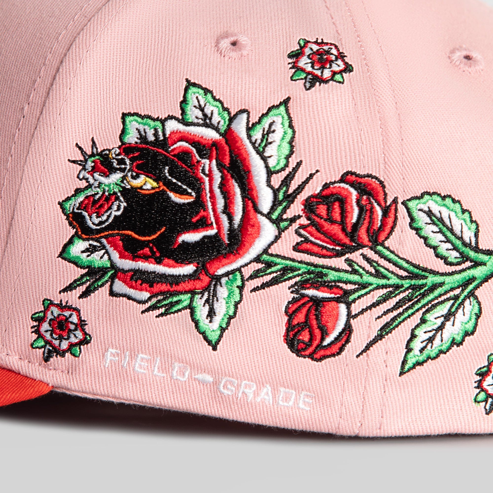 Field Grade Buy Her Flowers Rose Royce Twill Trucker Hat with pink and red floral embroidery on the front panel.