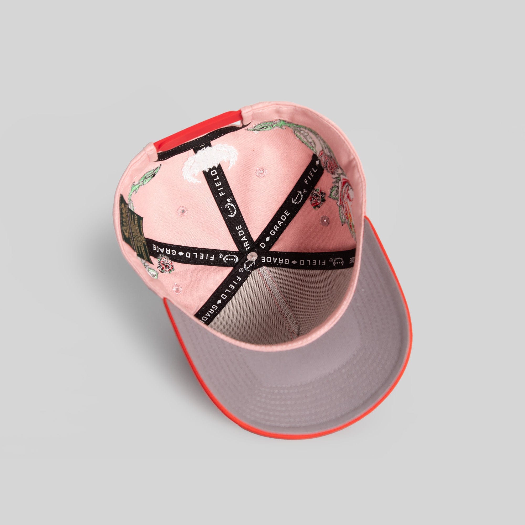 Pink Rose Royce Twill Trucker hat by Field Grade with embroidered floral design and adjustable snapback closure.