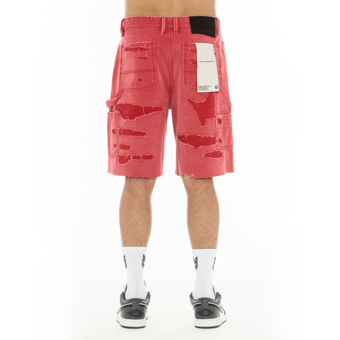 Cult of Individuality red canvas Carpenter Shorts featuring a denim style, with visible stitching and functional pockets.
