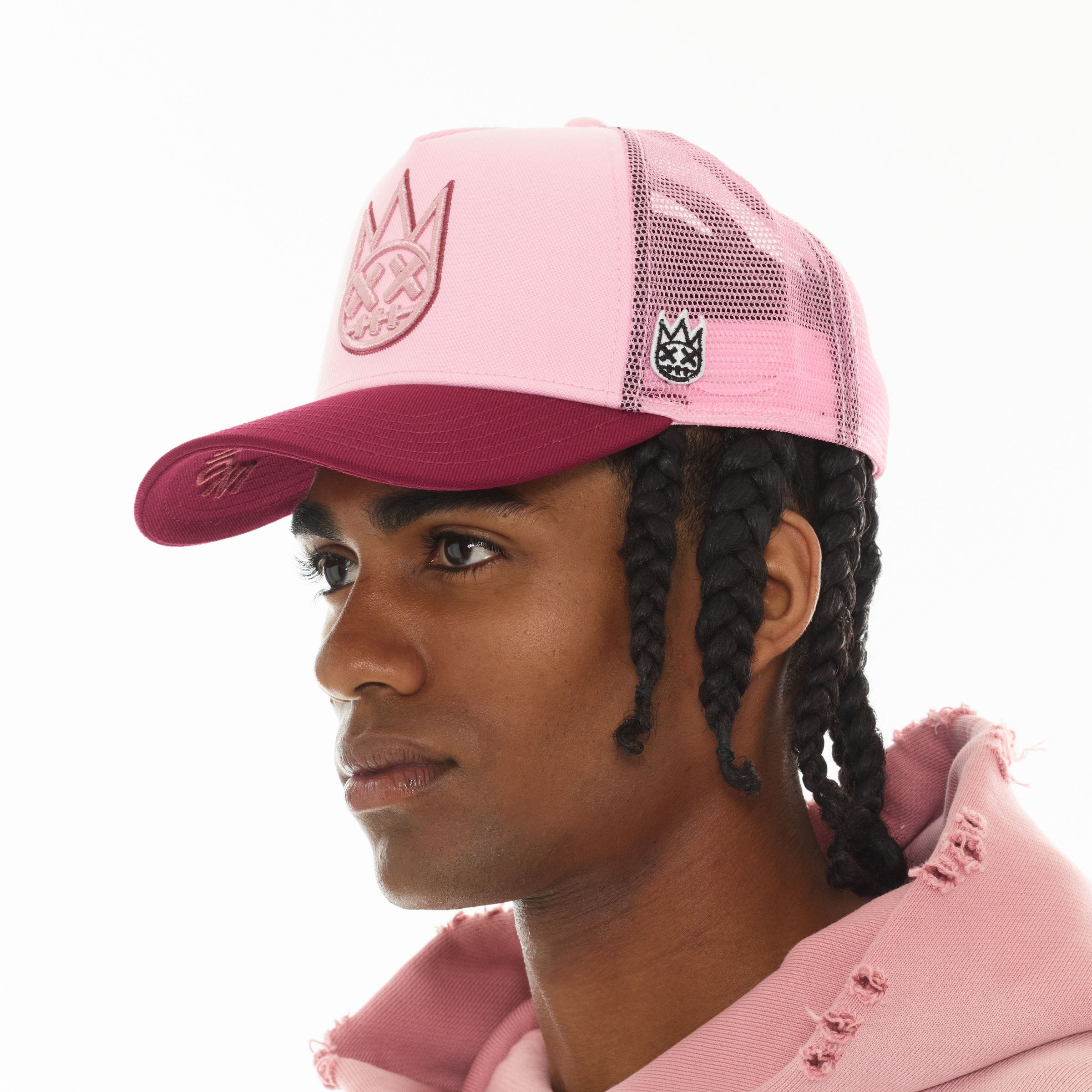 Cult of Individuality Cult Logo mesh back trucker hat with breathable mesh panels and adjustable snap closure.
