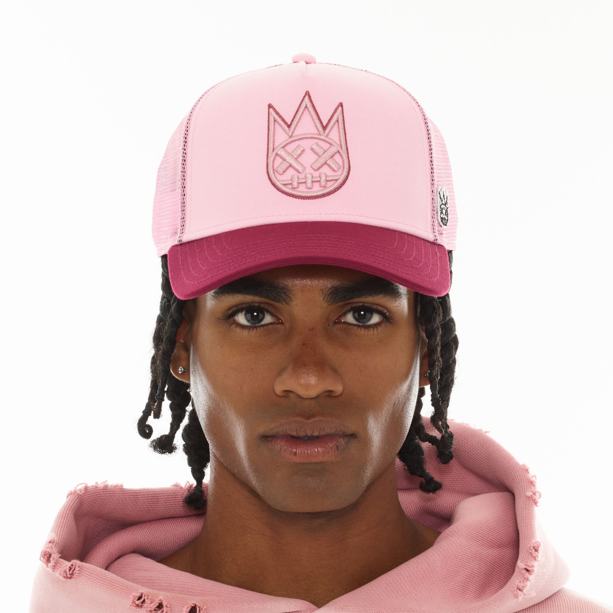 Cult of Individuality Cult Logo mesh back trucker hat with adjustable snap closure and embroidered logo on front.