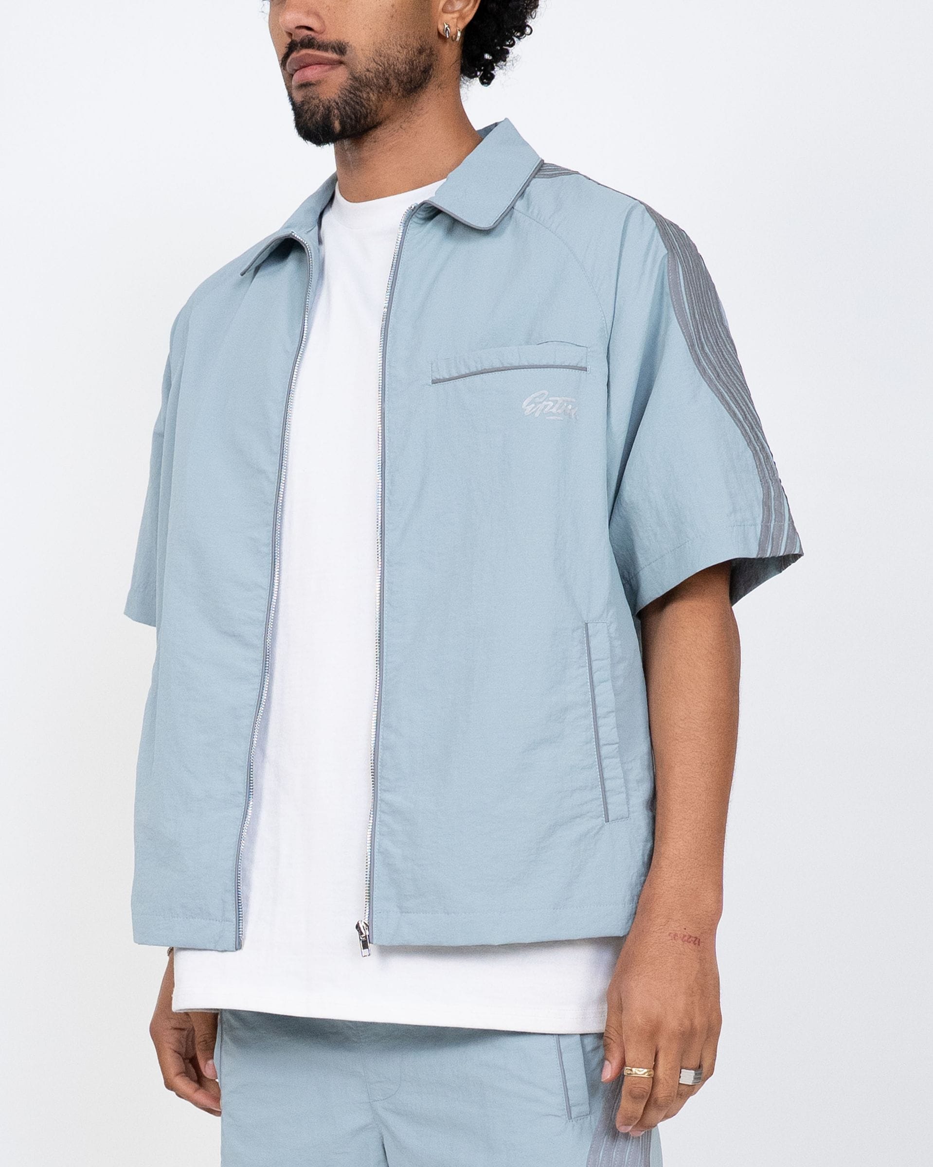 Blue EPTM Valley Shirt set with matching shorts, casual style, soft fabric, and comfortable fit, suitable for everyday wear.