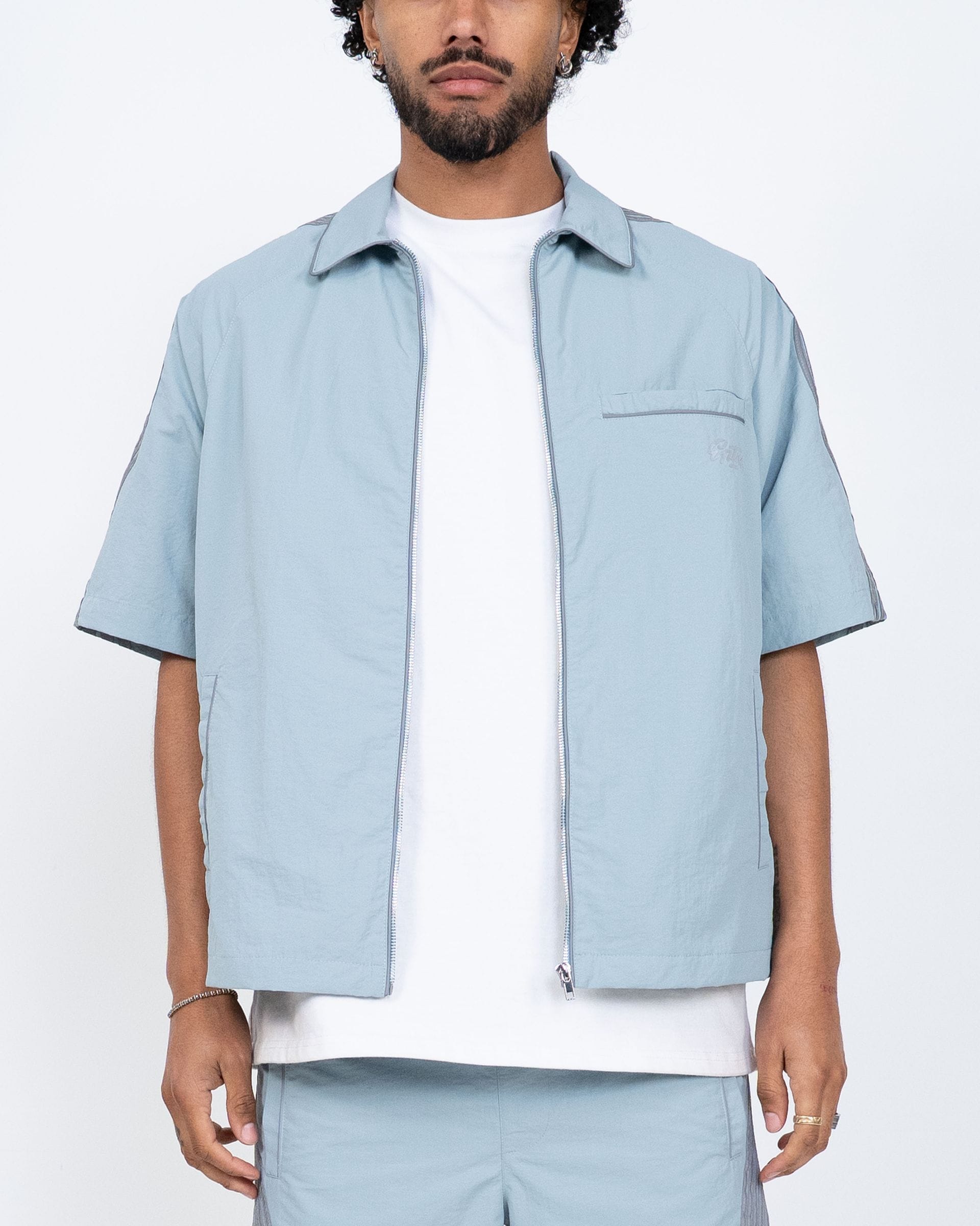 Blue EPTM Valley Shirt set featuring a stylish shirt and shorts, perfect for casual wear and comfortable summer styling.