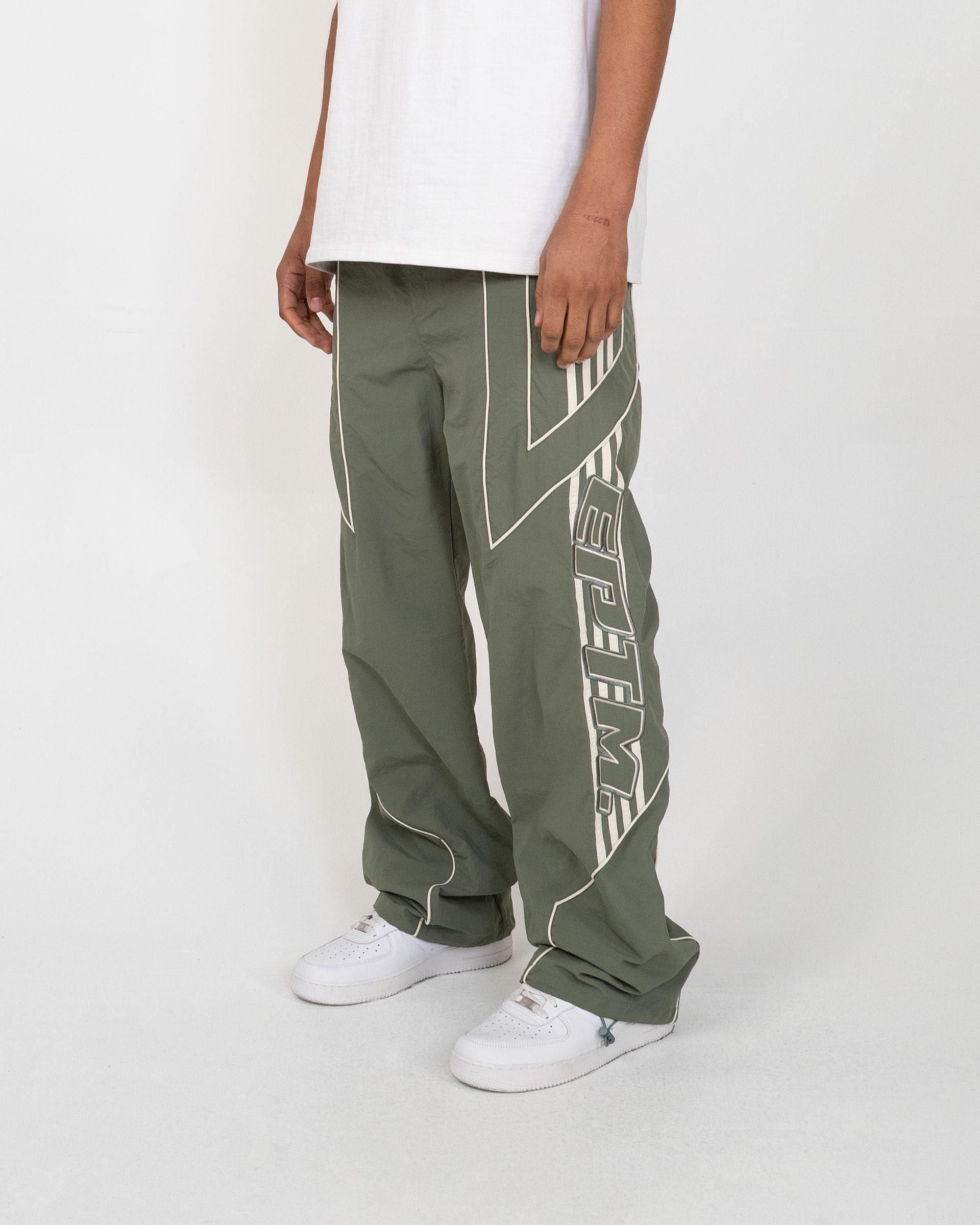EPTM Pepe track pants in black, featuring athletic fit and side pockets, made from comfortable, breathable fabric.