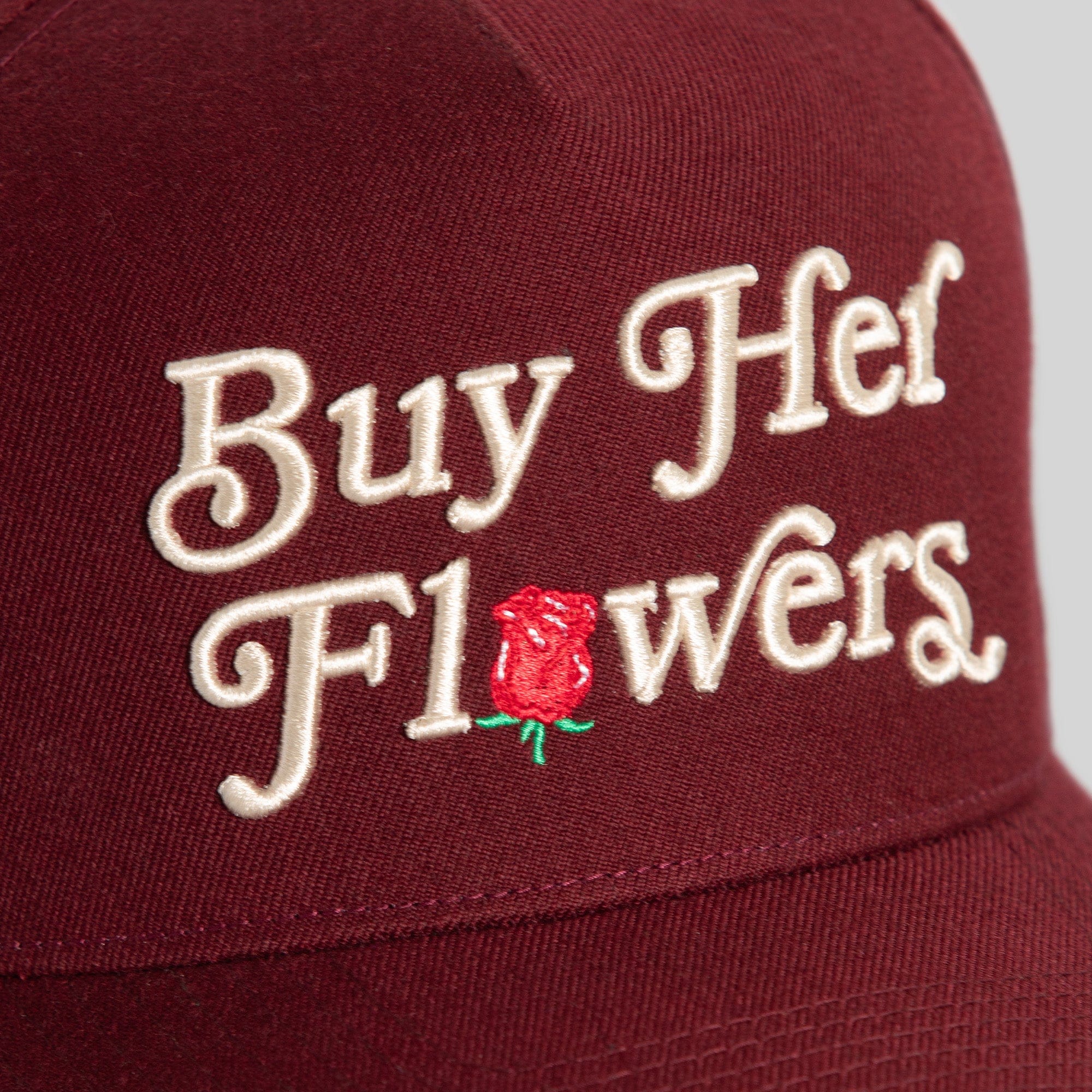 Field Grade Buy Her Flowers Bordeaux Wool Trucker hat with a structured brim and stylish design.