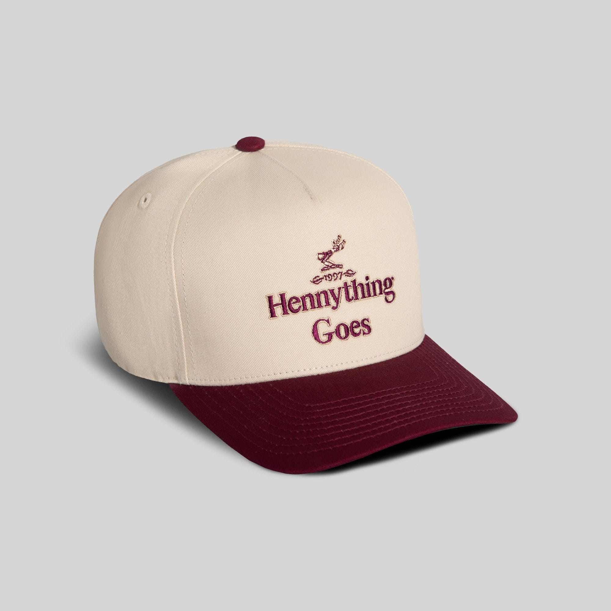 Field Grade Hennything Goes Bordeaux Twill Trucker hat with curved brim and adjustable strap, showcasing classic trucker style.