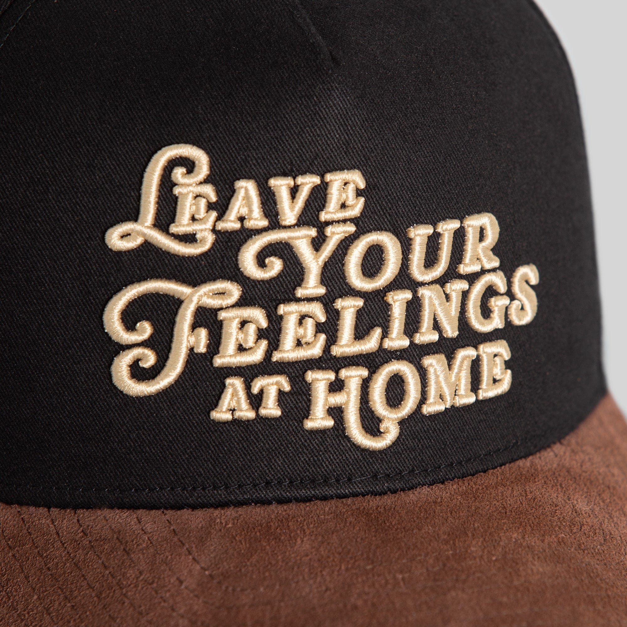 Black mocha twill and suede trucker hat by Field Grade with adjustable strap and classic design.