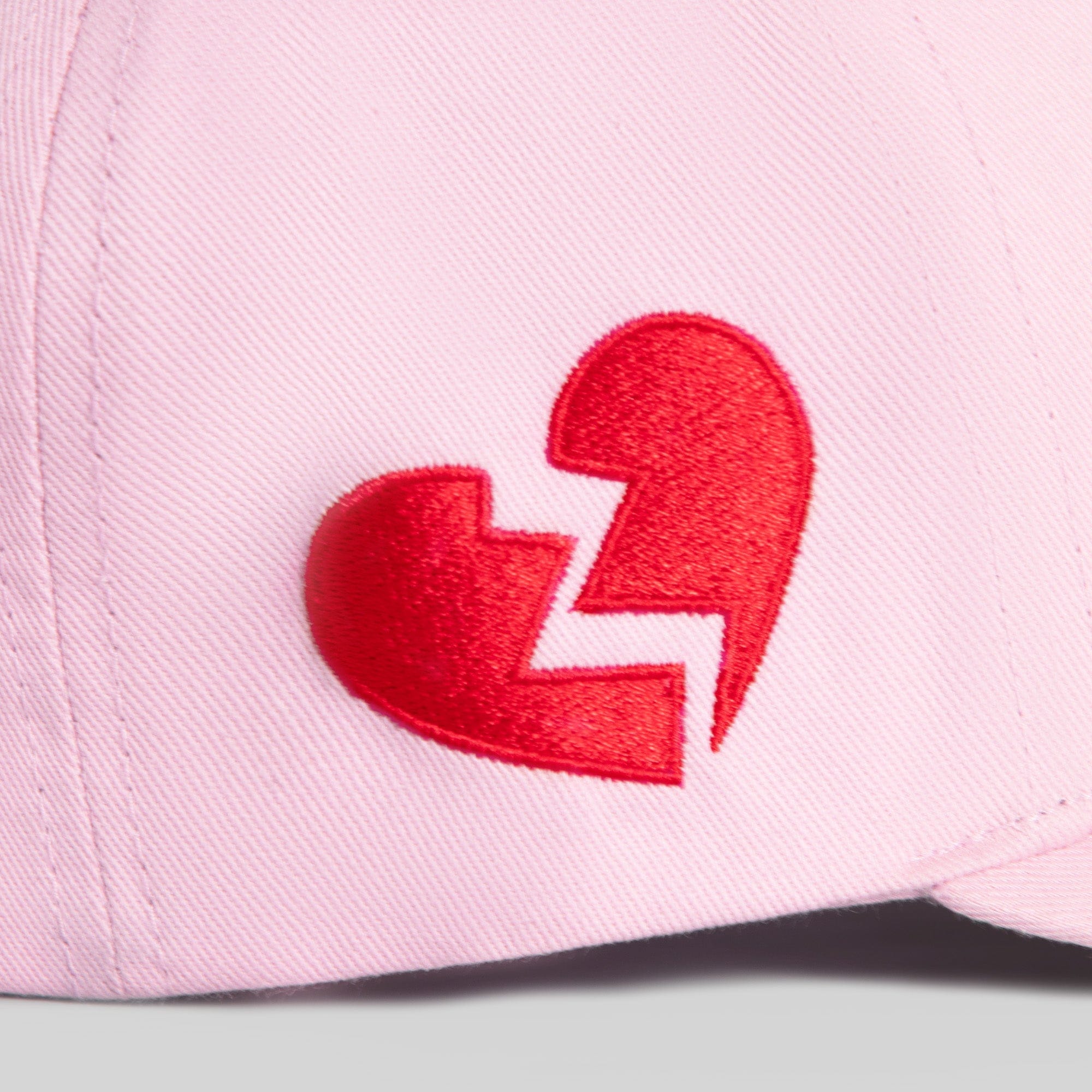 Field Grade Leave Your Feelings Rose Wool Trucker Hat showing a stylish wool hat with embroidered rose design and adjustable strap.