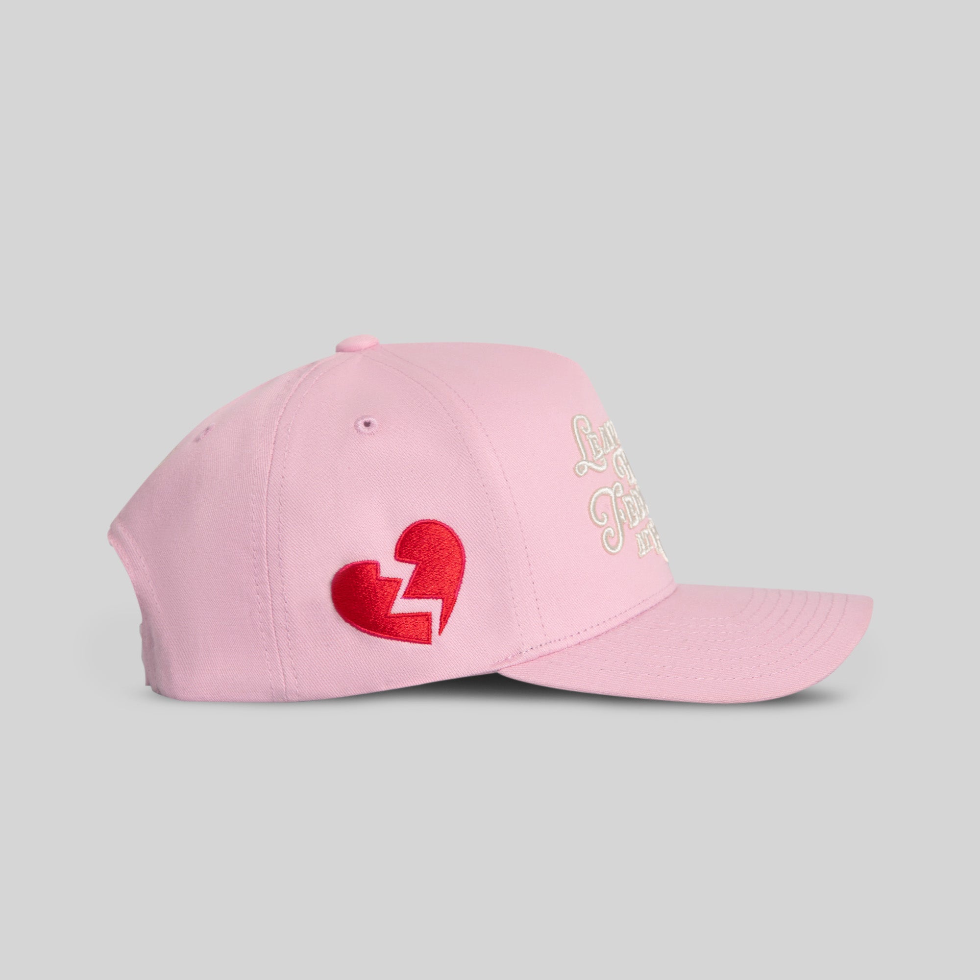 Field Grade Leave Your Feelings Rose Wool Trucker Hat, side view showing embroidered design and classic trucker style.