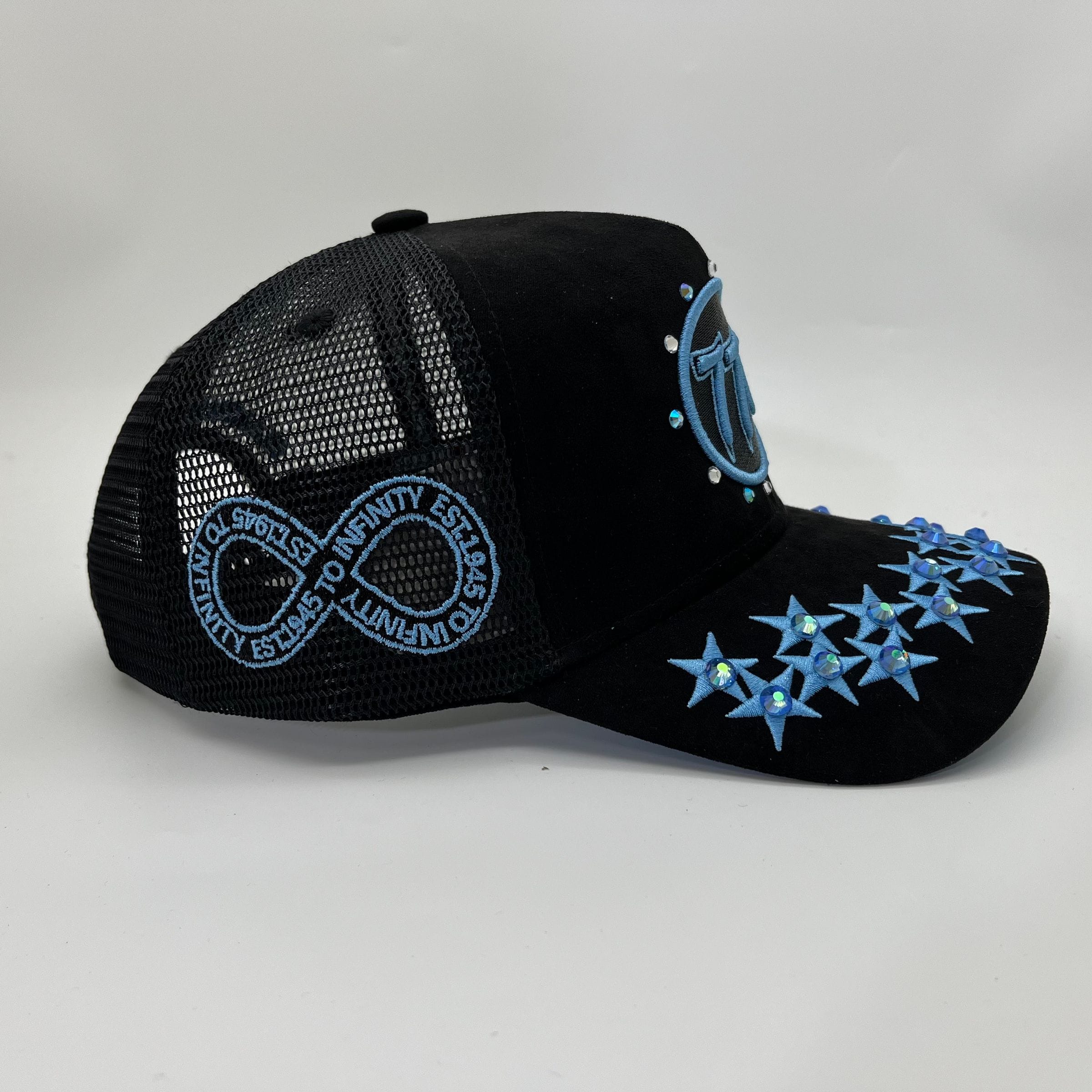Hudson Outerwear V1 Diamond Suede Trucker Hat in black and university blue, featuring a classic mesh back and structured front panel.