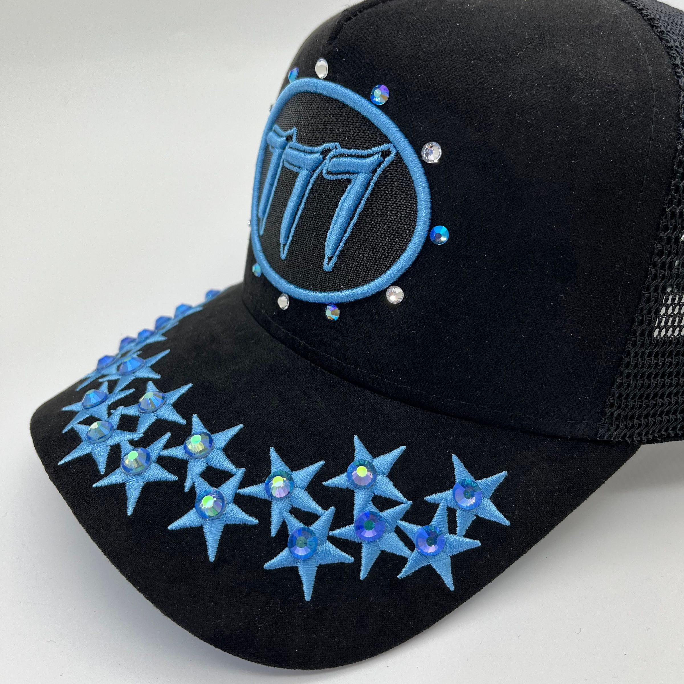 Black and university blue Hudson Outerwear V1 Diamond Suede Trucker Hat with structured front and mesh back panels.