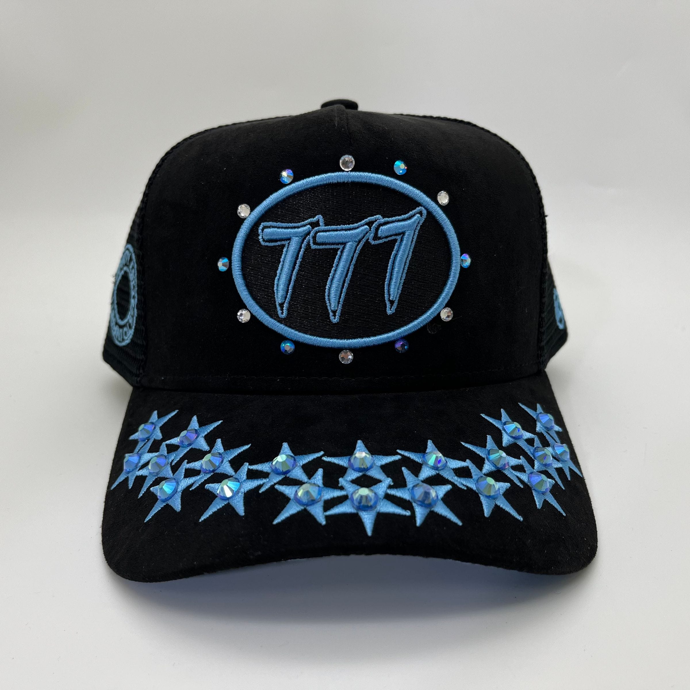 Black and university blue Hudson Outerwear V1 Diamond Suede Trucker Hat with mesh back and adjustable strap.