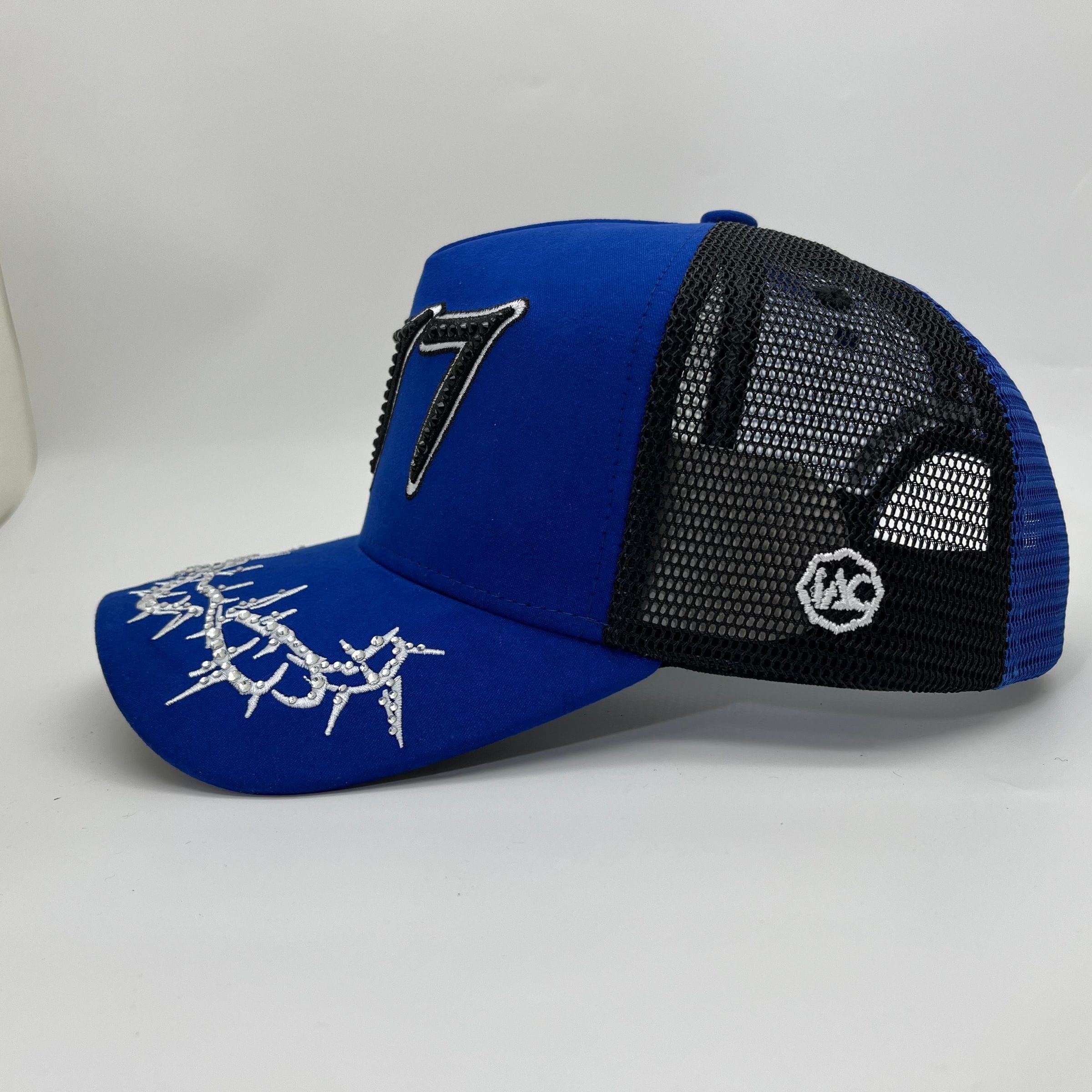 Blue Hudson Outerwear V2 Diamond Suede Trucker Hat with adjustable strap and curved brim, made of soft suede material.