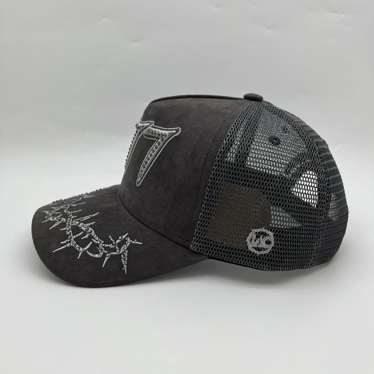 Hudson Outerwear V2 Diamond Suede Trucker Hat in tan with mesh back and curved brim, casual outdoor accessory.
