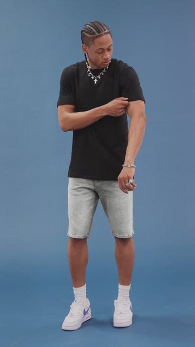 Jordan Craig OG Cascade Jean Shorts featuring a stylish denim design, displayed on a mannequin with a casual outdoor setting.