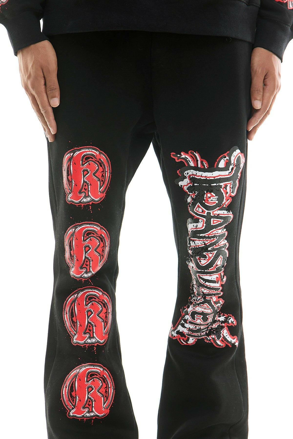 KDNK translucent black sweatsuit set displayed on a hanger, showcasing its lightweight fabric and stylish design.