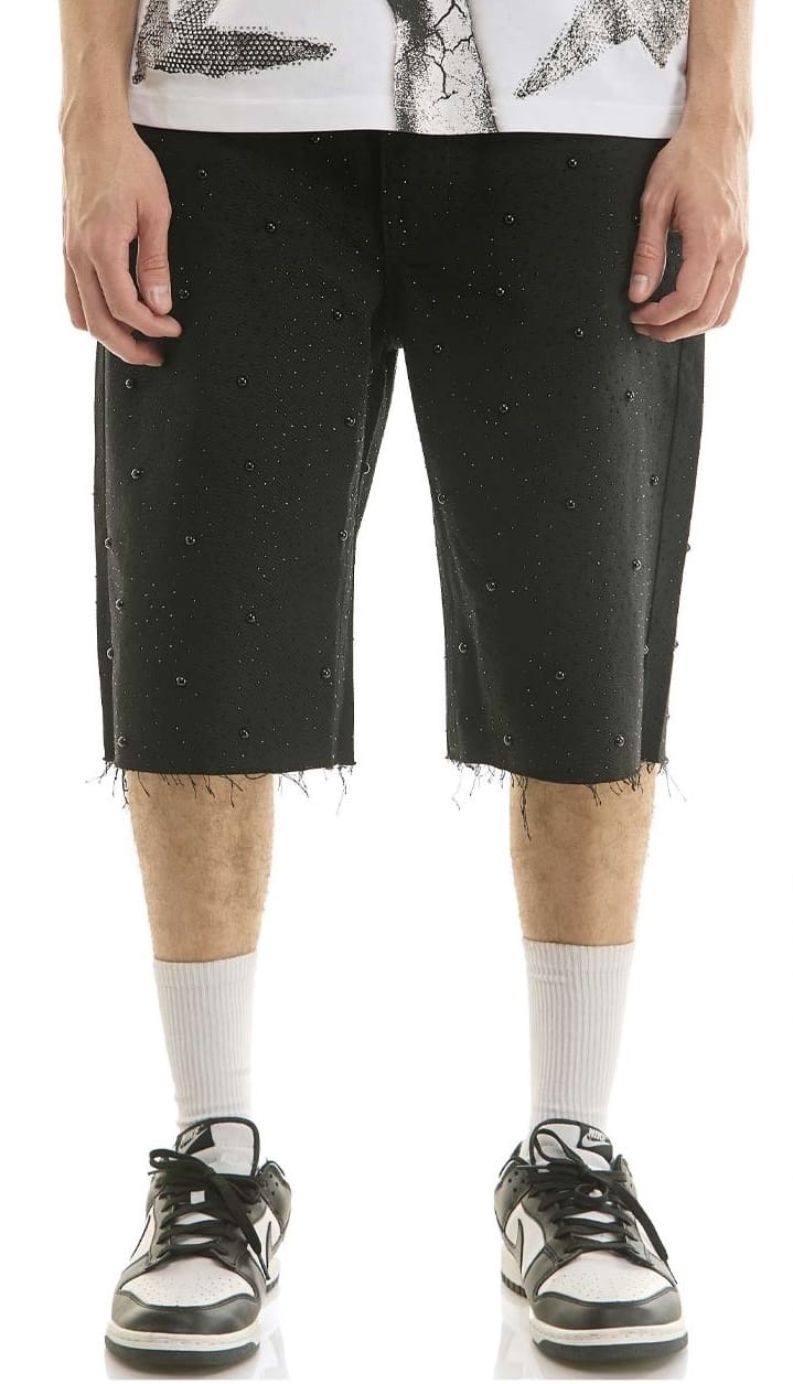 Black KDNK rhinestone-embellished jean shorts with frayed hem and distressed details, styled for a casual summer look.