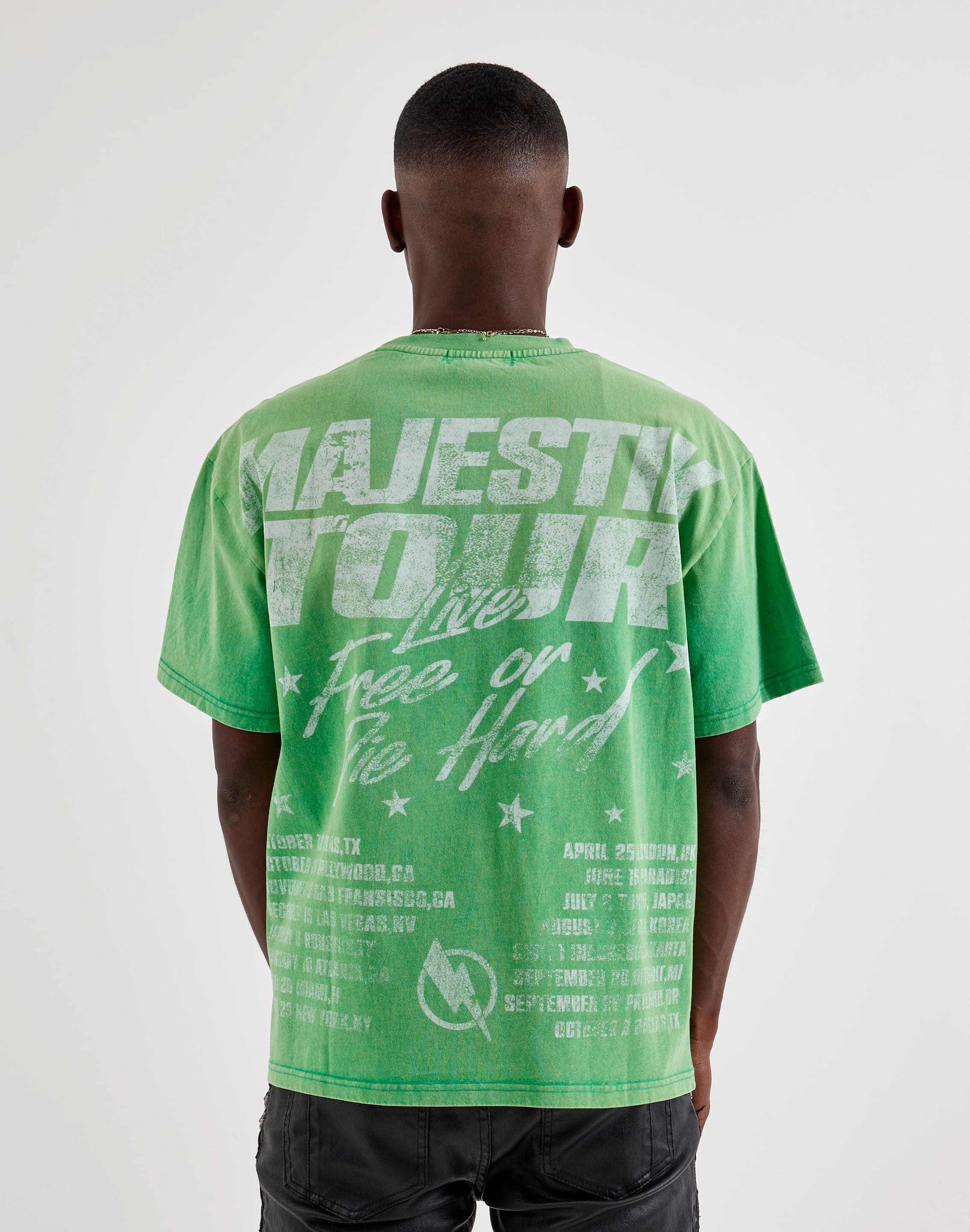 Majestik Tour Tee, a colorful graphic T-shirt laid flat, showcasing vibrant design and casual style.