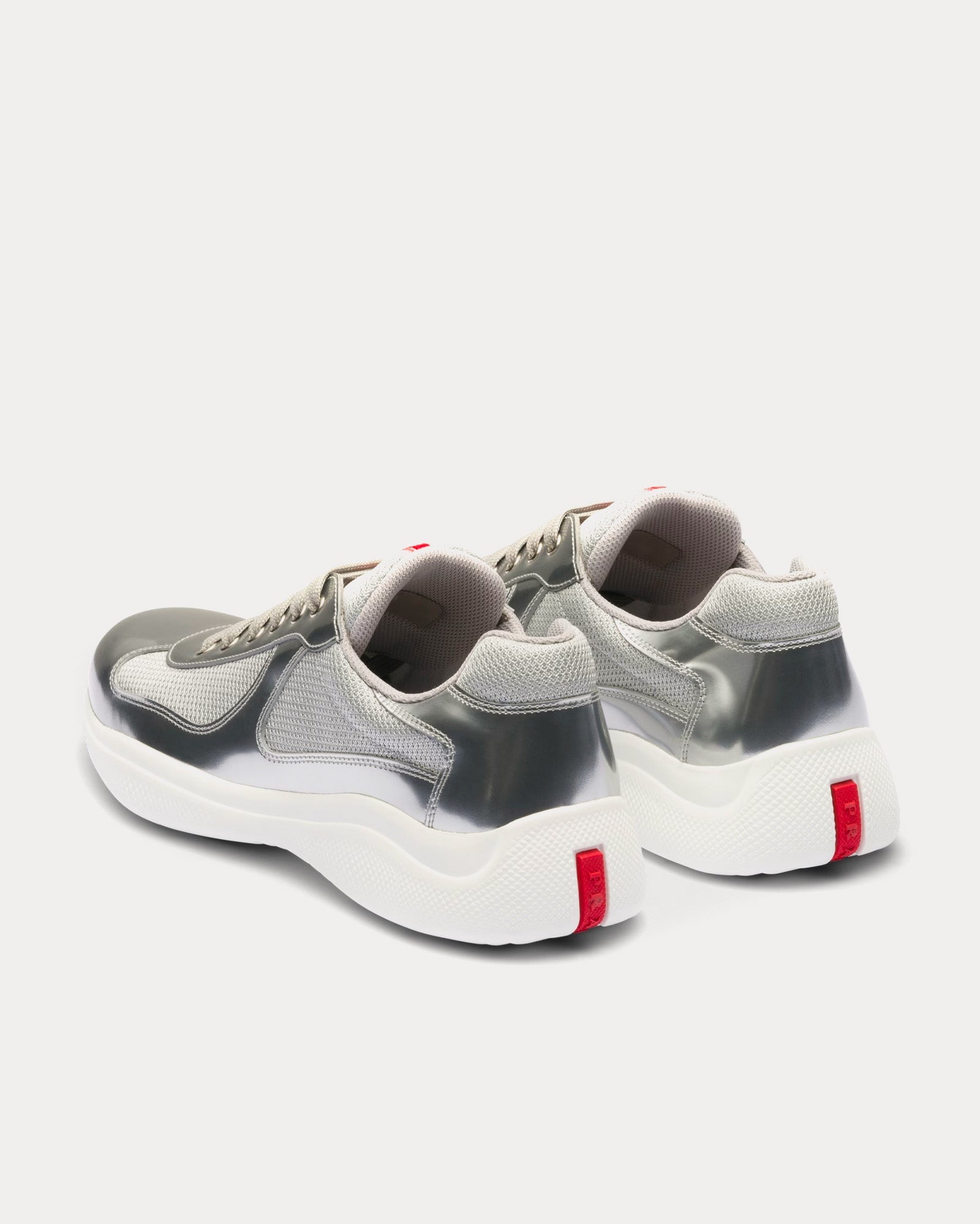 Prada America's Cup silver sneakers featuring metallic leather and bike fabric, showcasing a sleek athletic design.