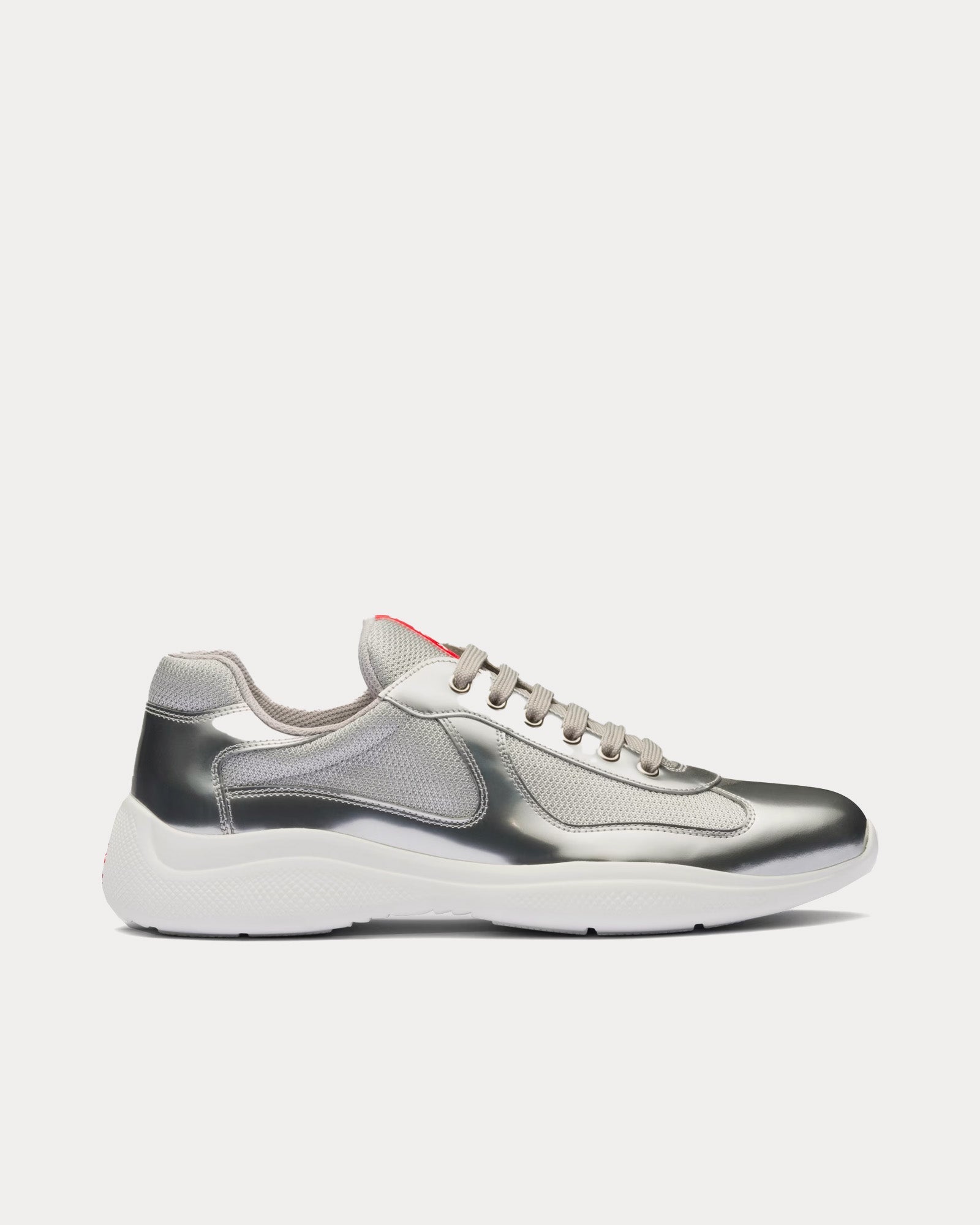 Prada America's Cup silver sneakers featuring metallic leather and bike fabric design on a white background.
