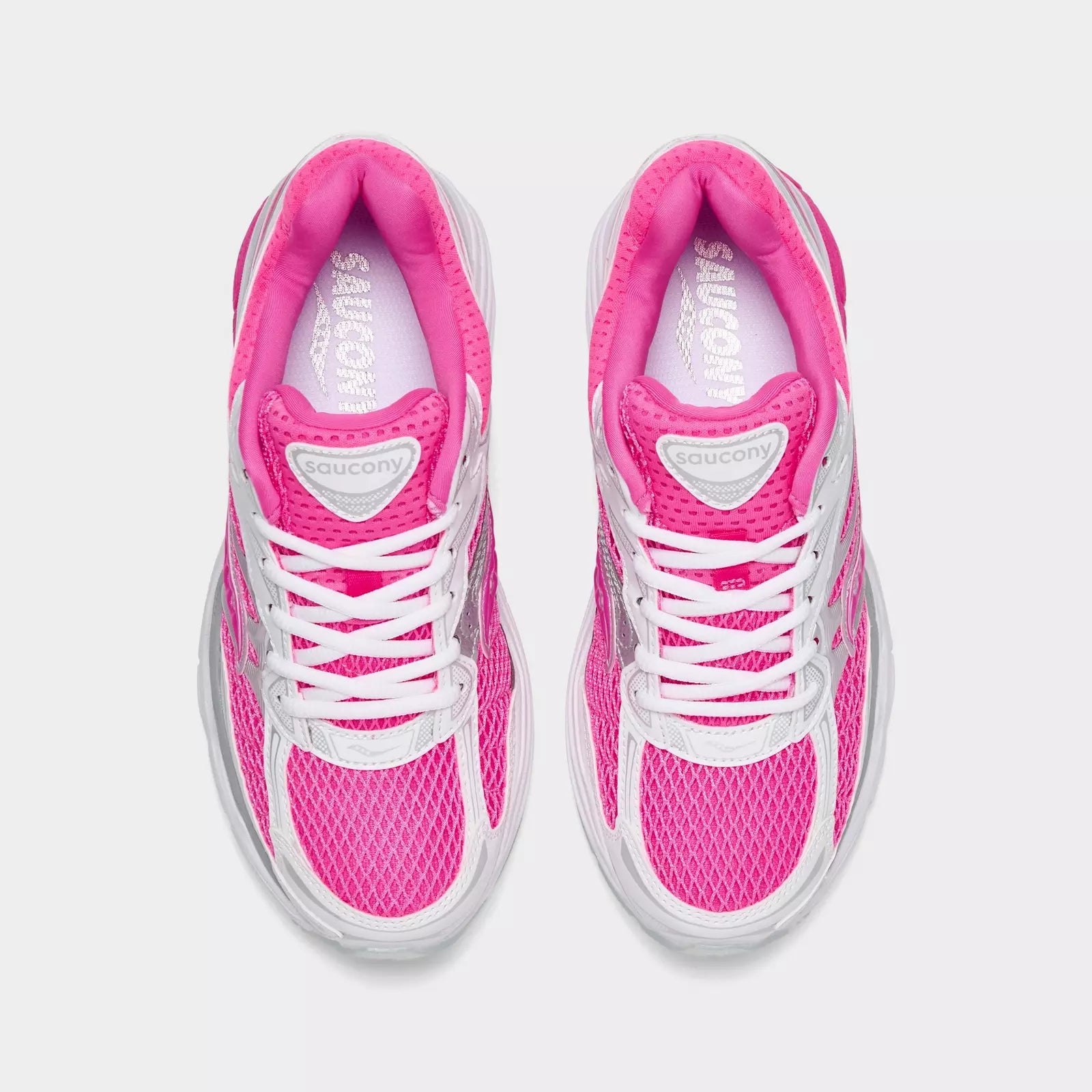 Women's Saucony ProGrid Omni 9 pink sneakers with cushioned sole and supportive design, ideal for running and active wear.
