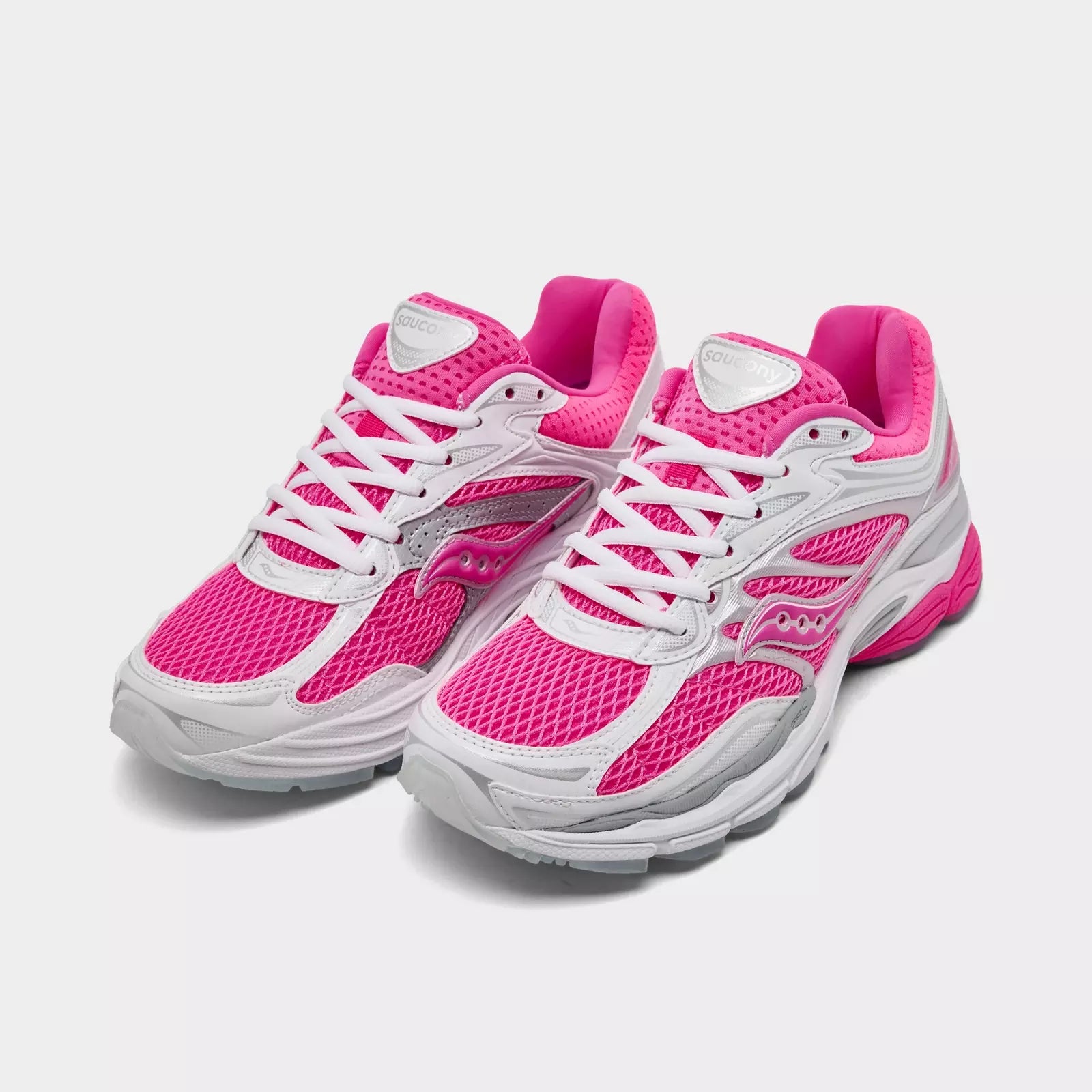 Pink Saucony ProGrid Omni 9 women's sneakers with cushioned sole and sporty design, suitable for running and casual wear.