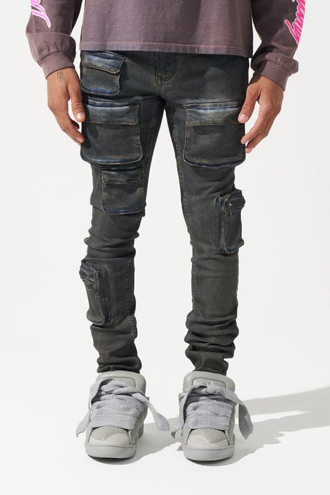 Serenede Wave Cargo Jeans in denim, featuring multiple pockets and a relaxed fit, displayed on a hanger against a white background.