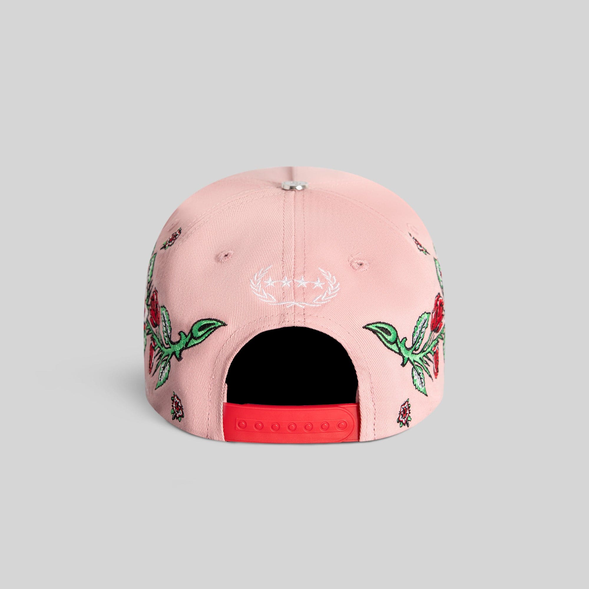 Pink and red Rose Royce Twill Trucker hat by Field Grade featuring a stylish floral design and classic trucker cap style.