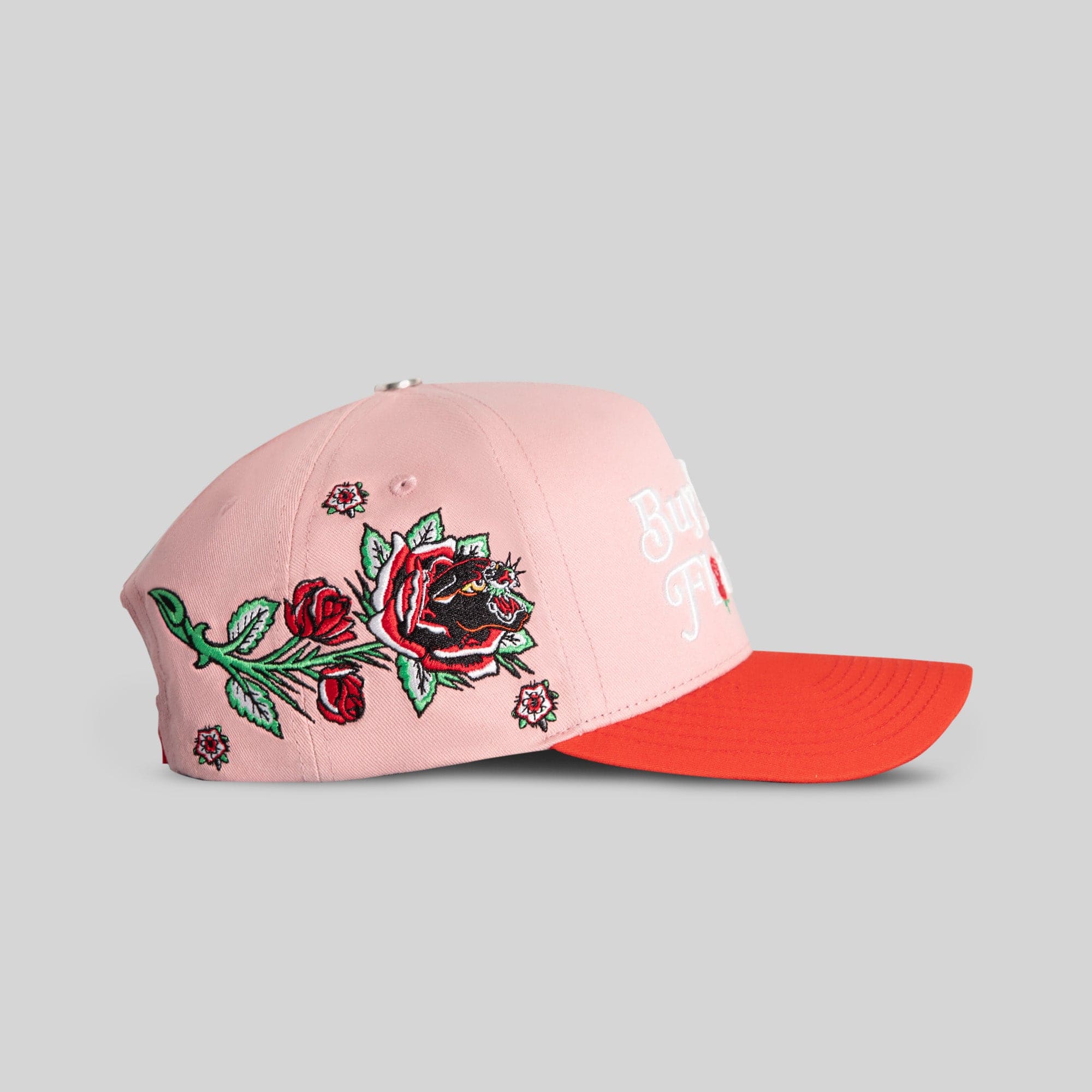 Pink and red Rose Royce Twill Trucker Hat by Field Grade featuring a structured cap with floral embroidery.