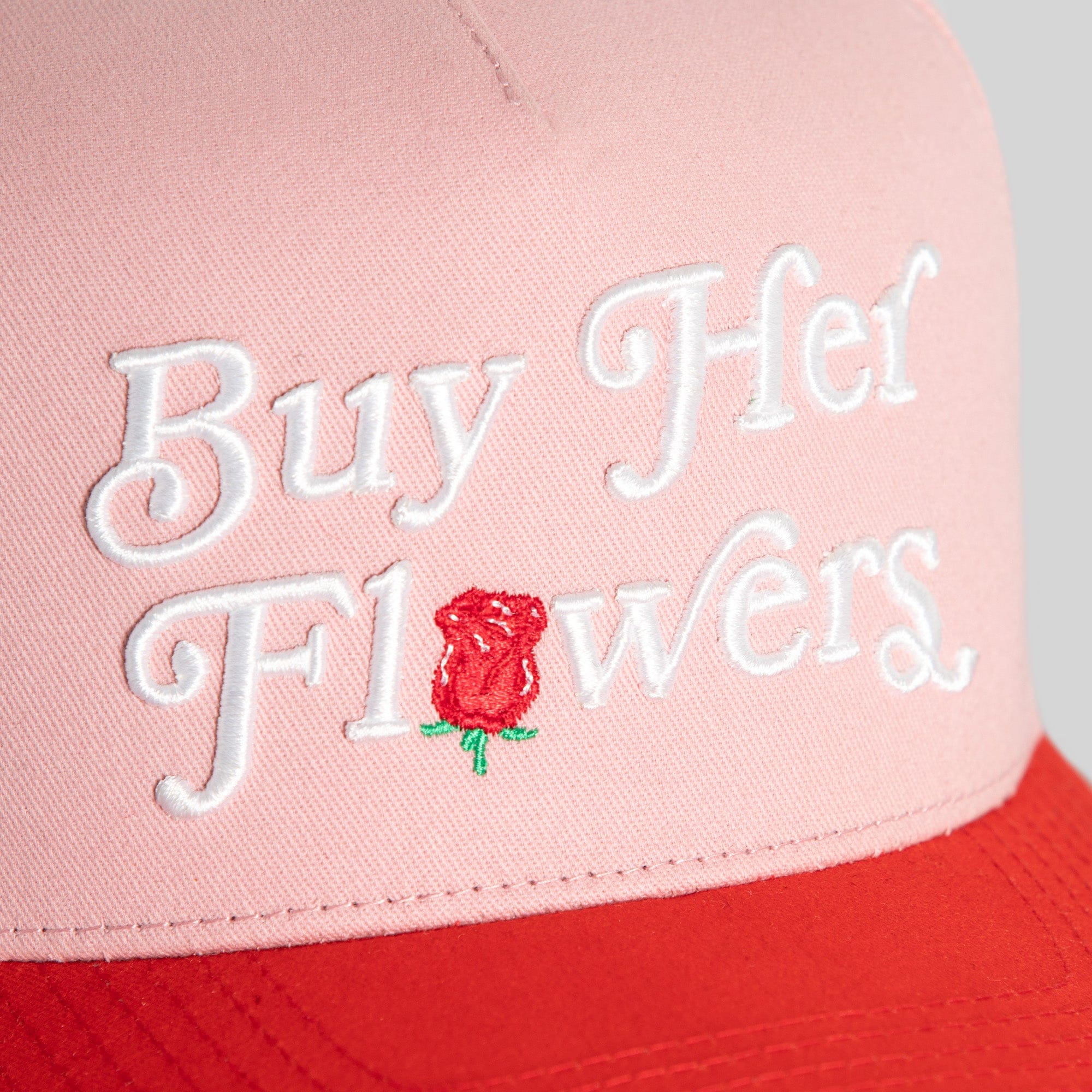 Pink Rose Royce Twill Trucker hat by Field Grade featuring floral embroidery and adjustable snapback closure.
