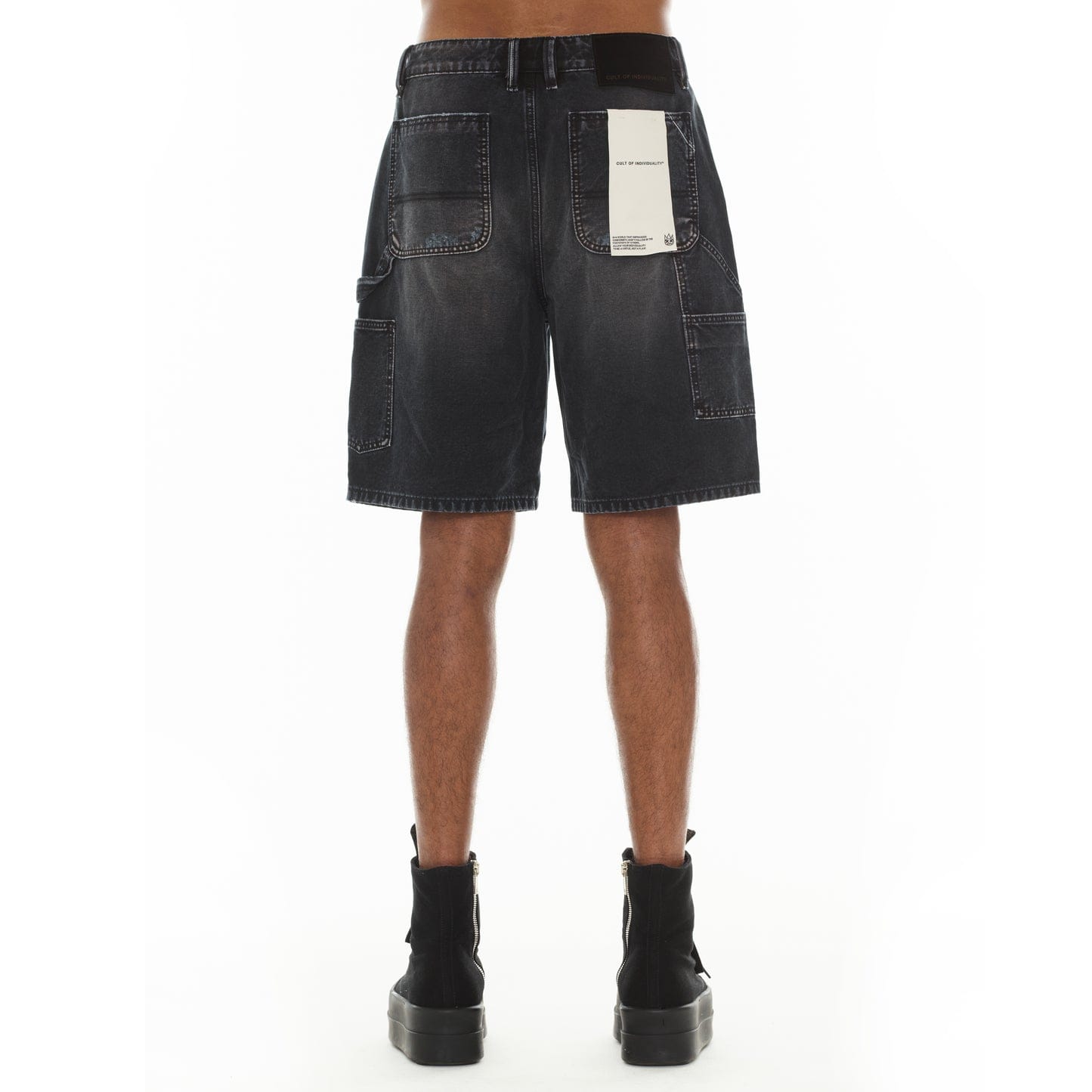 Cult of Individuality black canvas carpenter shorts with denim-style design and multiple utility pockets.