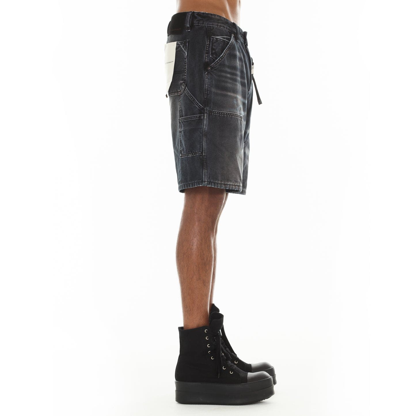 Cult of Individuality black canvas Carpenter Shorts with denim style, featuring multiple pockets and a rugged grunge design.