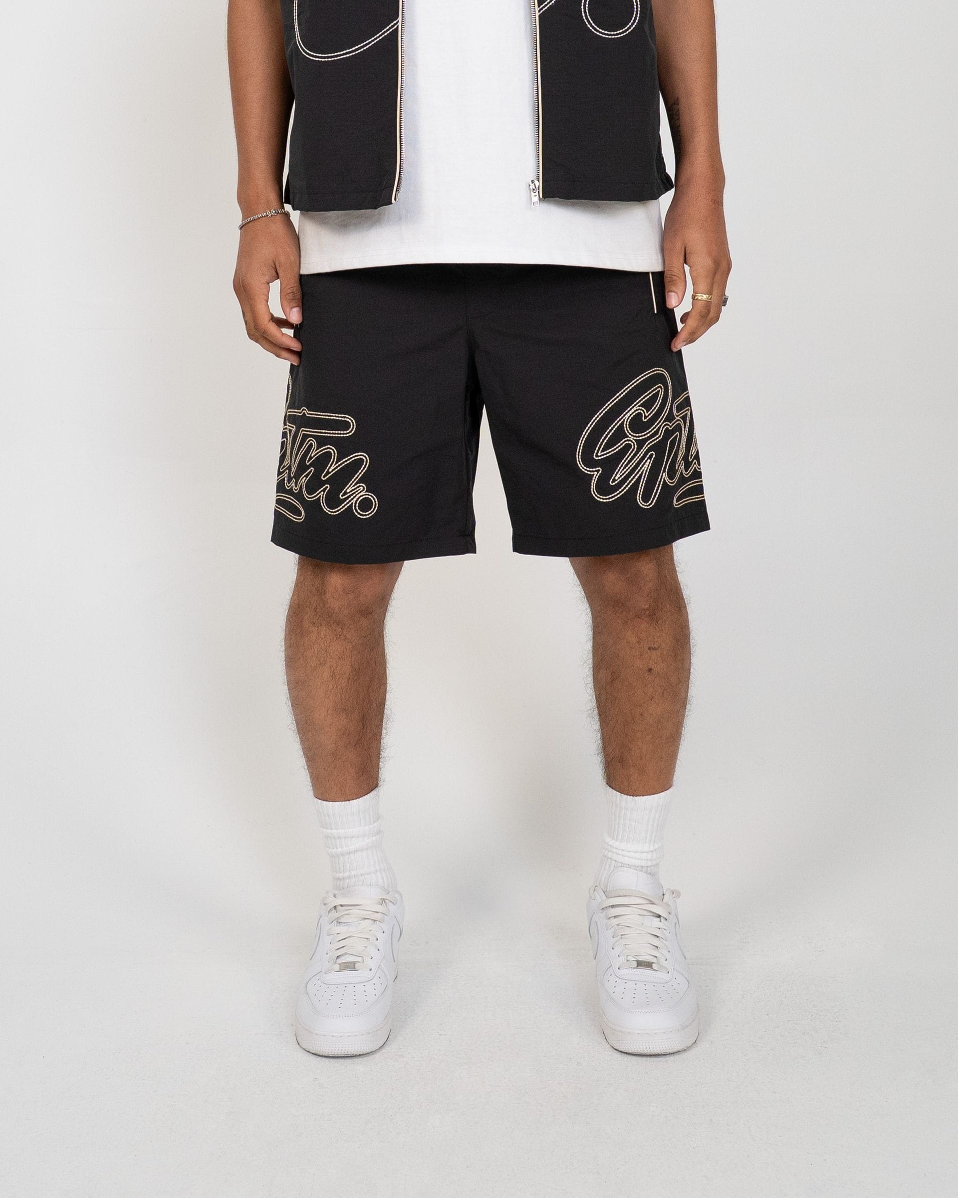 Black EPTM Yogo set with matching top and leggings, designed for comfort and flexibility during yoga practice.