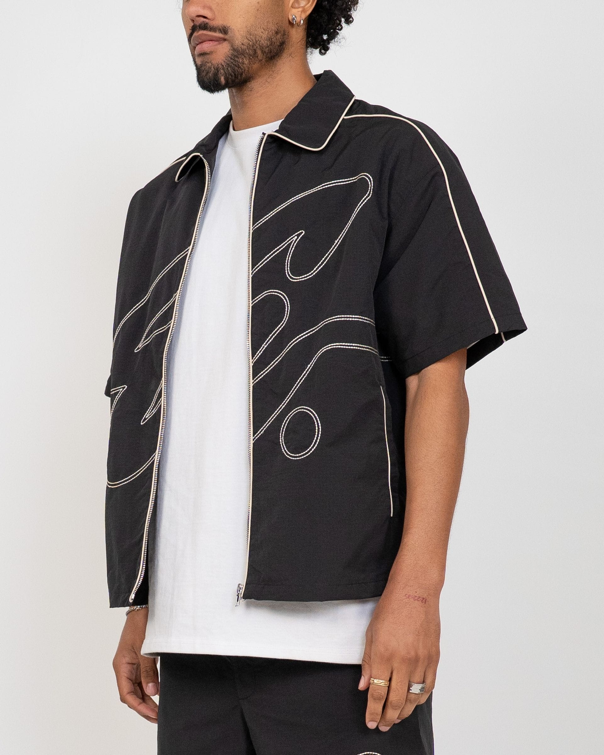 EPTM Black Yogo Set featuring a stylish, comfortable matching top and pants for active or casual wear.