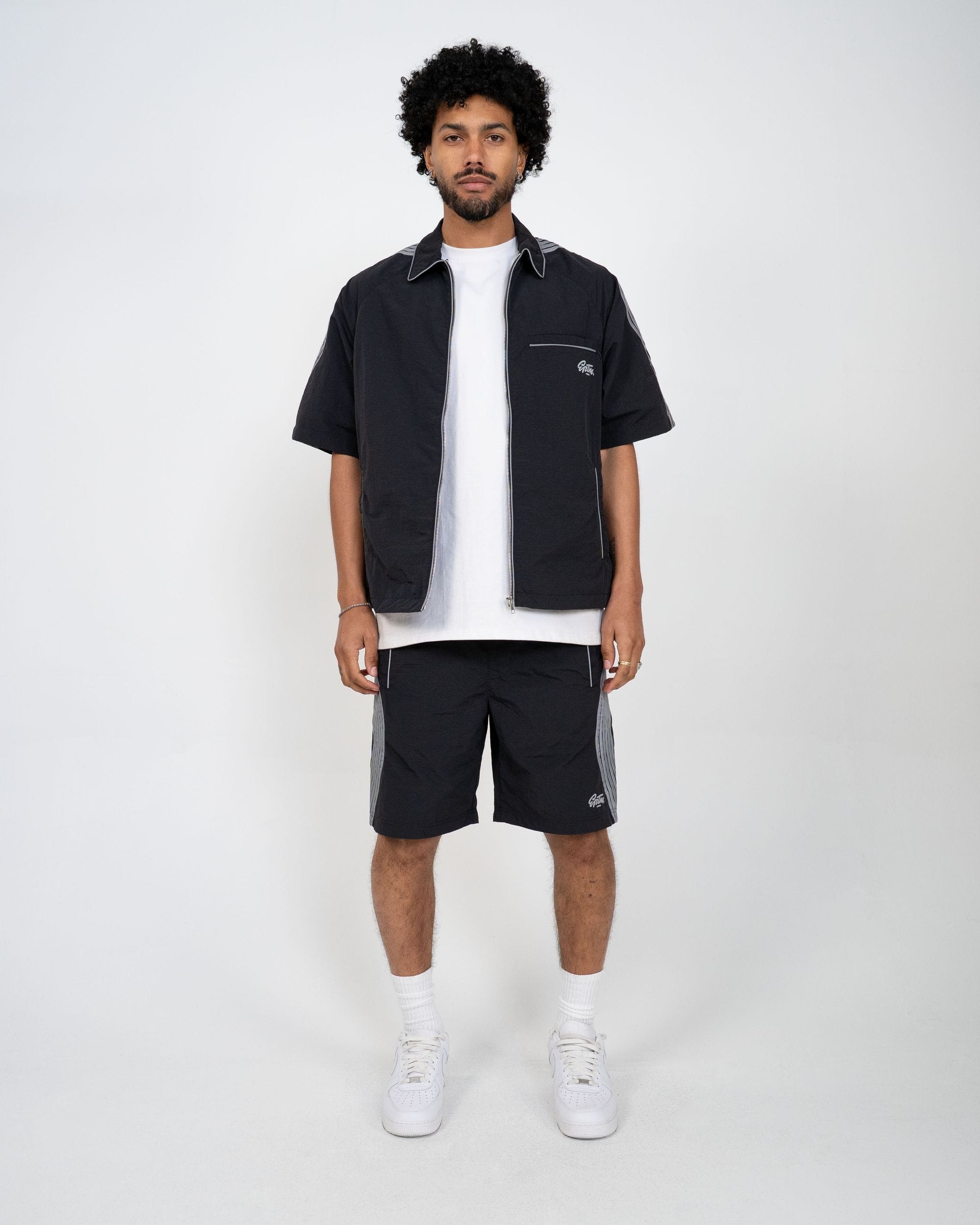 EPTM Valley Set in black, stylish matching clothing set featuring a top and pants, laid flat for display.