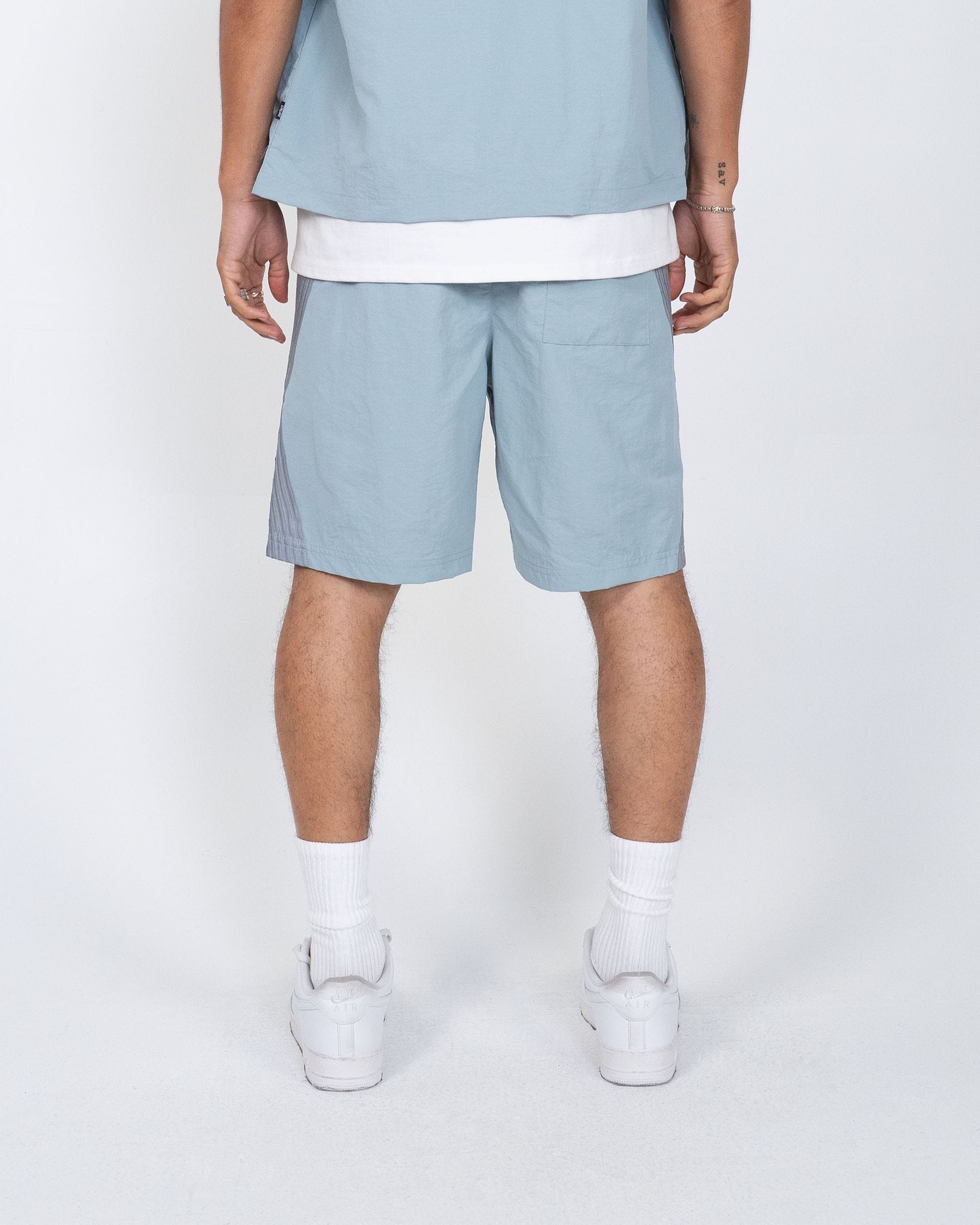 EPTM Valley shirt set in blue, featuring a stylish casual design with a comfortable fit.