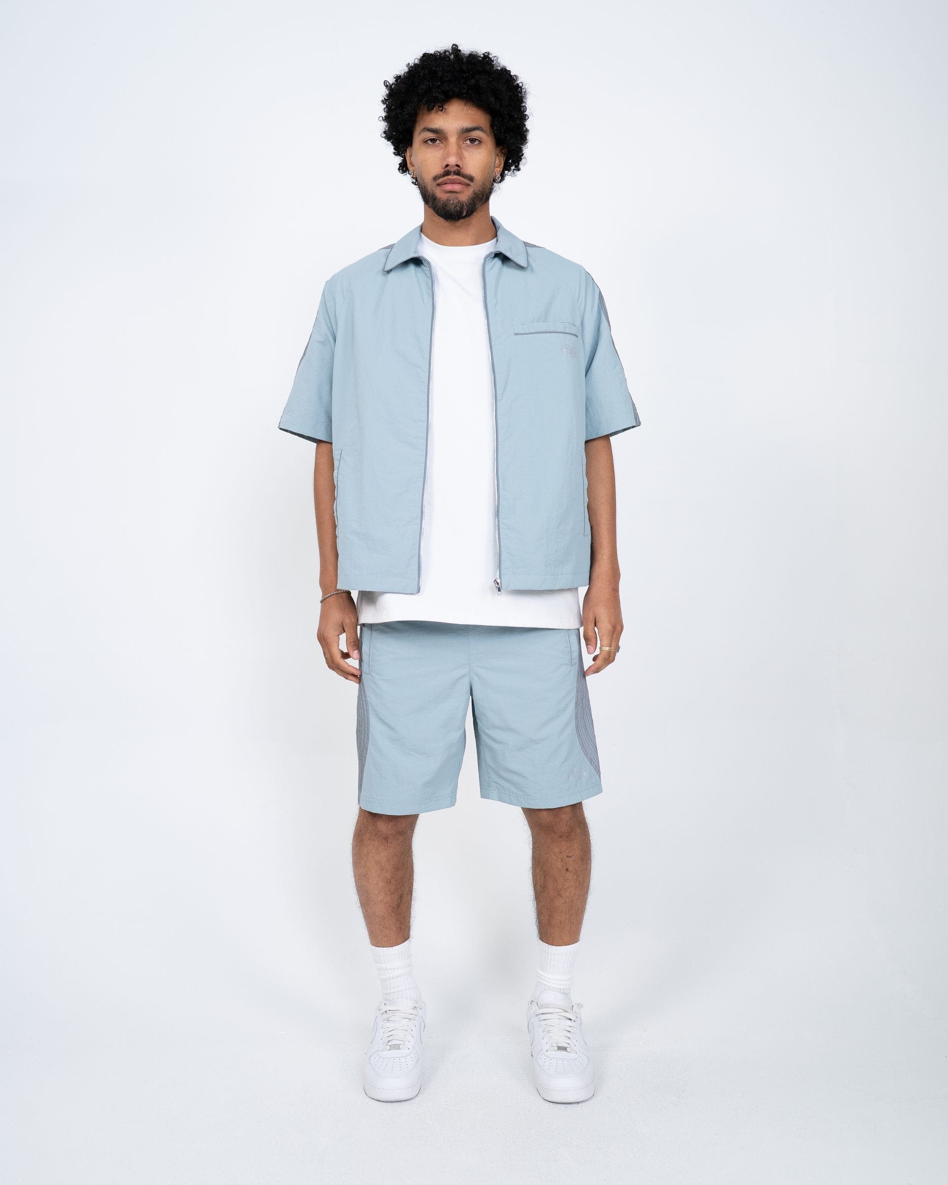 Blue EPTM Valley Shirt set featuring a stylish button-up shirt and matching pants, perfect for casual or semi-formal wear.