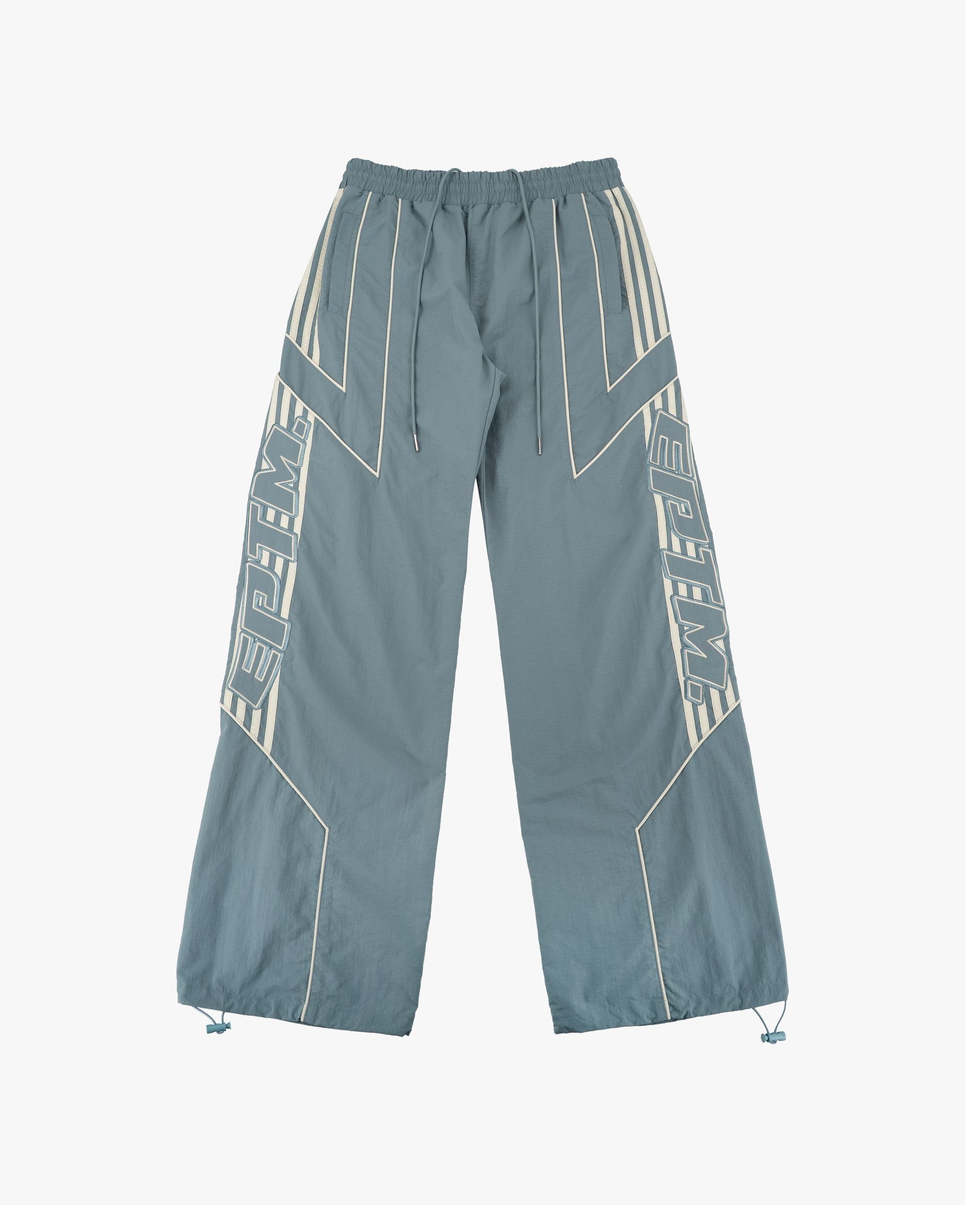 EPTM Pepe Track Pants, black athletic track pants with white side stripes, made of comfortable fabric for casual wear.