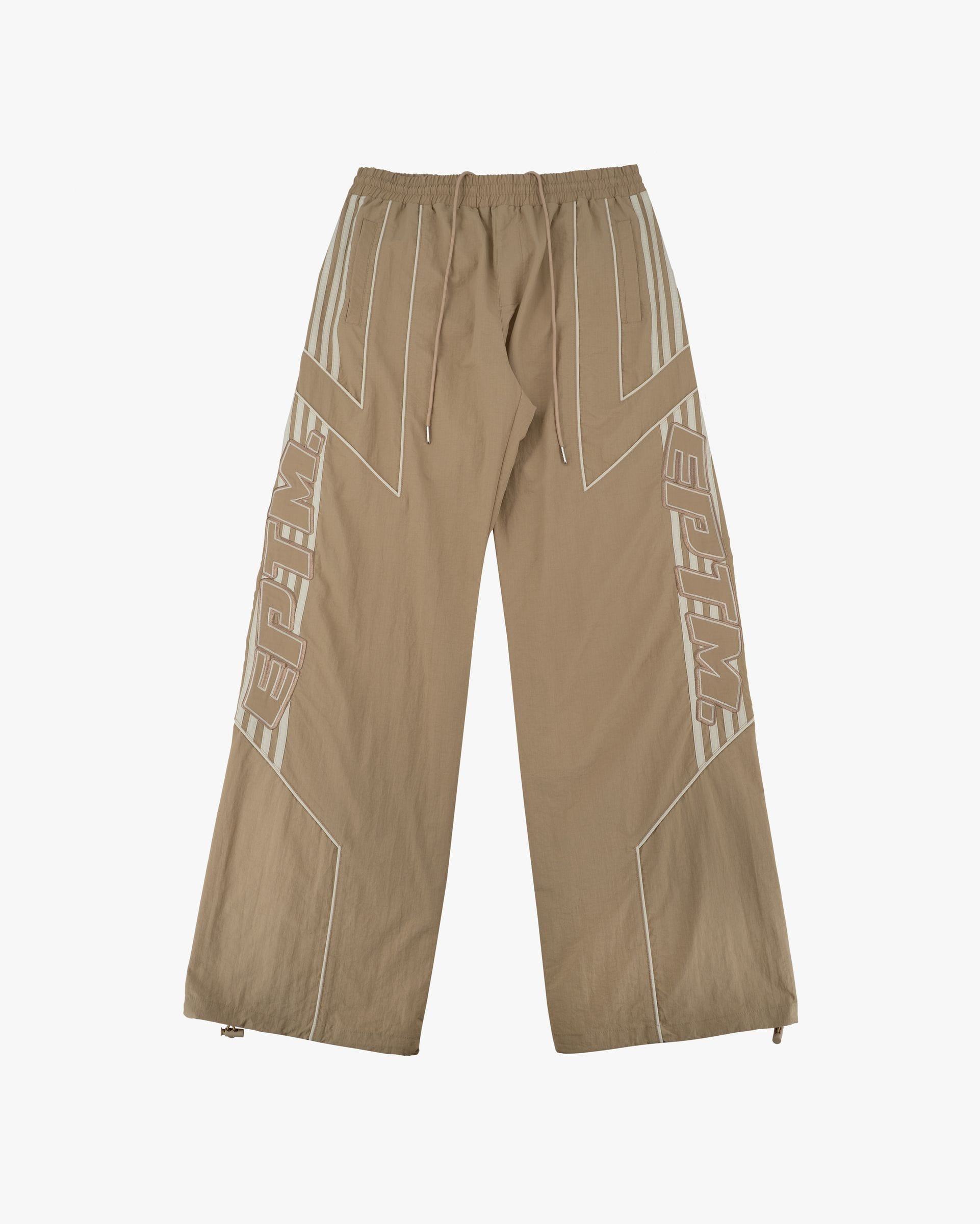 EPTM Pepe track pants in black, featuring a relaxed fit and adjustable drawstrings, displayed on a hanger against a plain background.