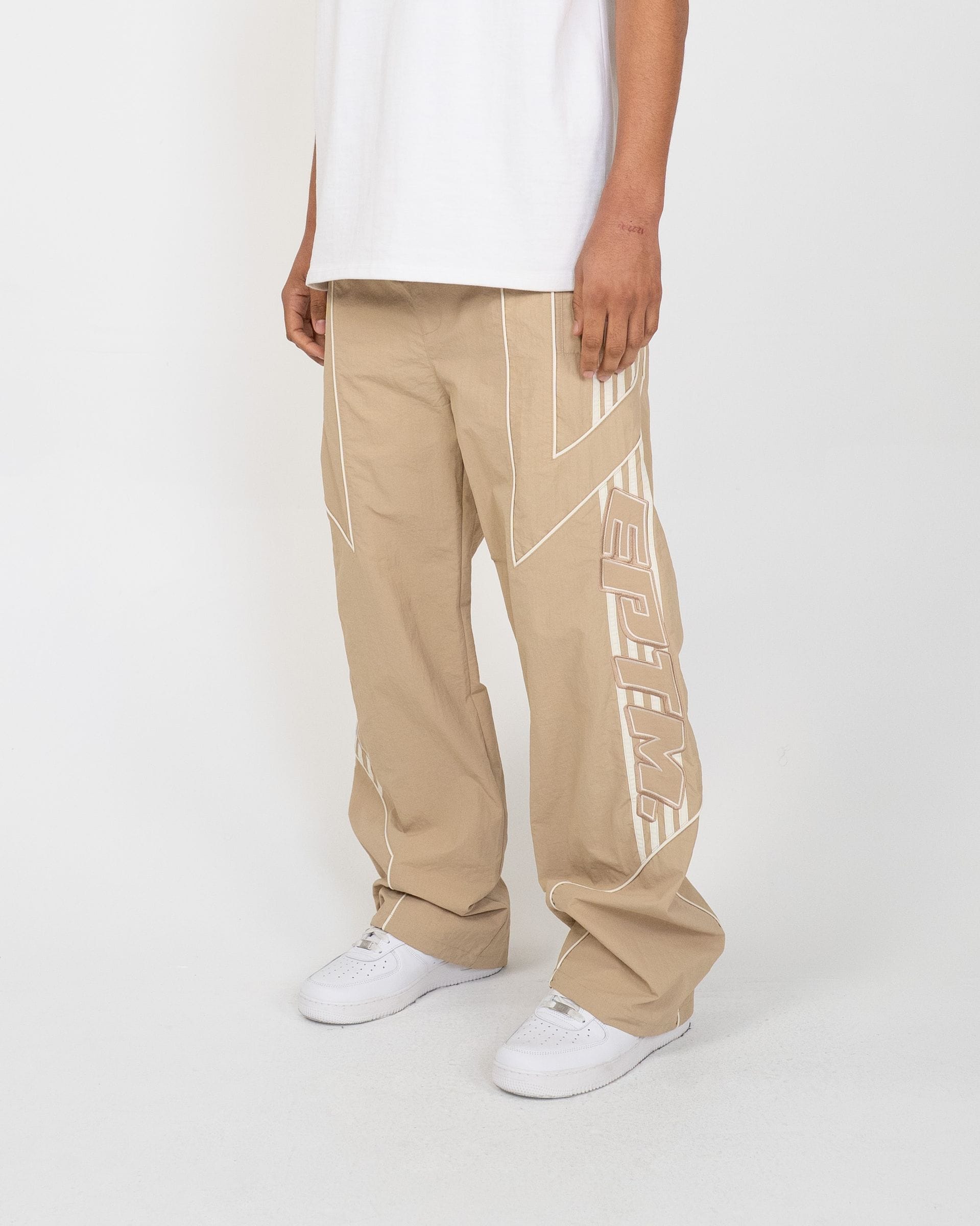 EPTM Pepe Track Pants, black athletic track pants with white stripe detailing, made for comfort and style.