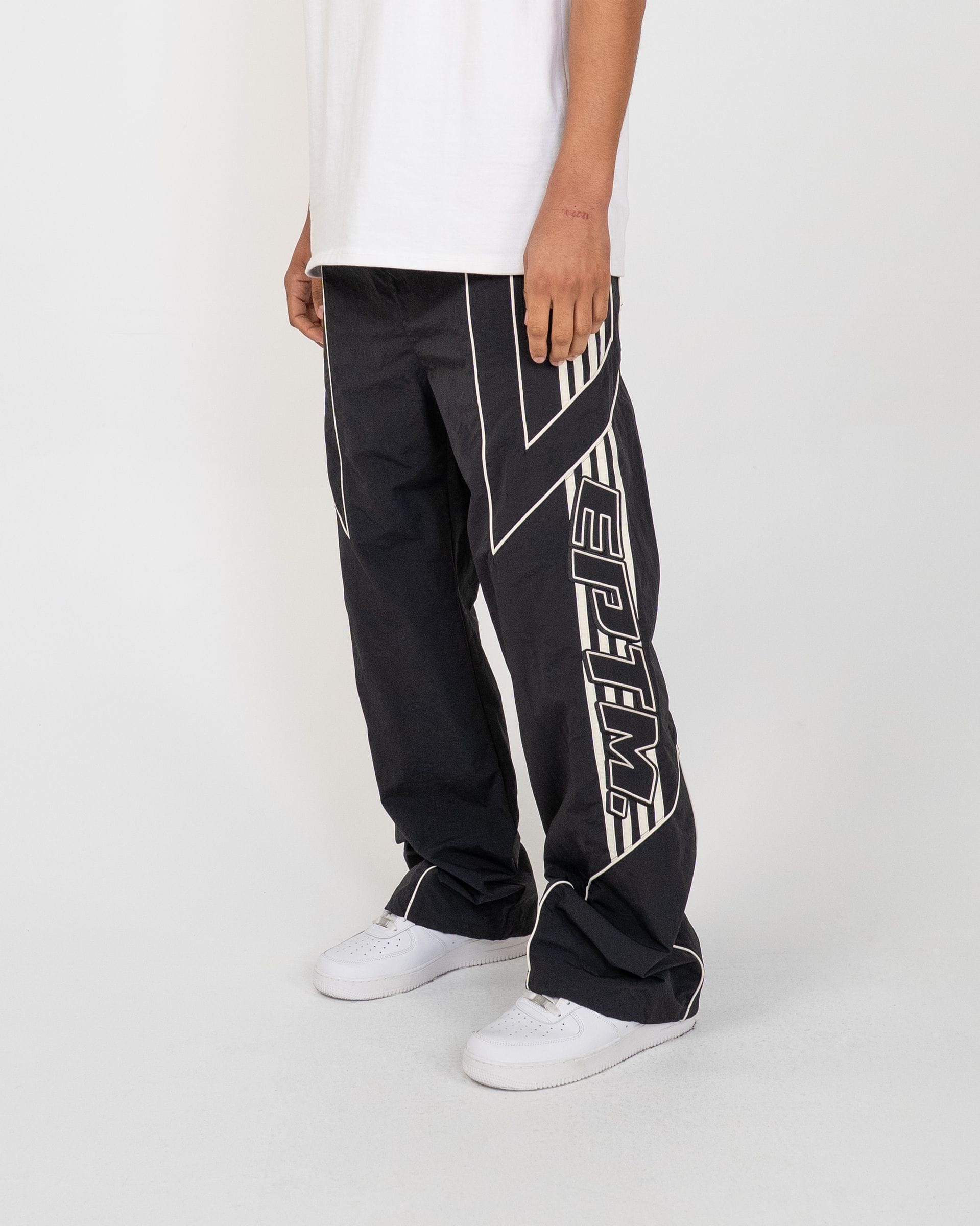 EPTM Pepe Track Pants, black athletic track pants with logo detailing, made for comfortable casual wear and sports activities.