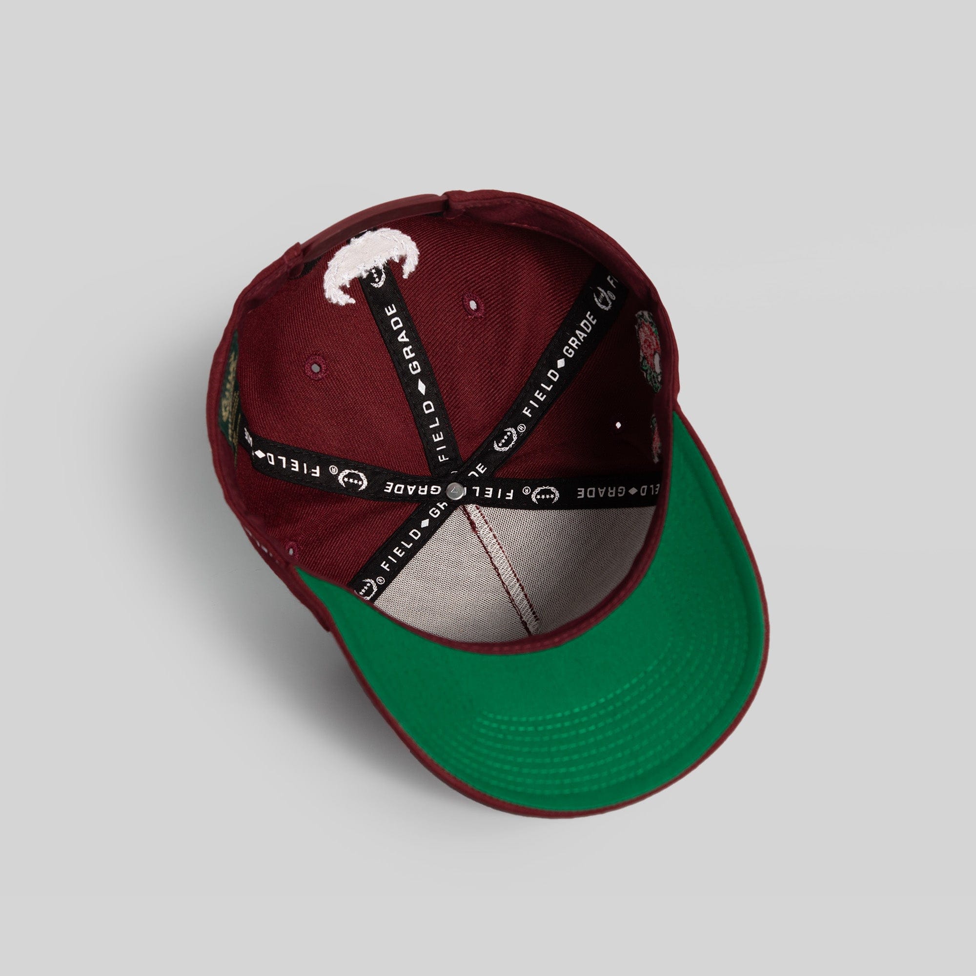 Field Grade Buy Her Flowers Bordeaux Wool Trucker hat with a structured crown and curved brim, stylish and warm for casual wear.