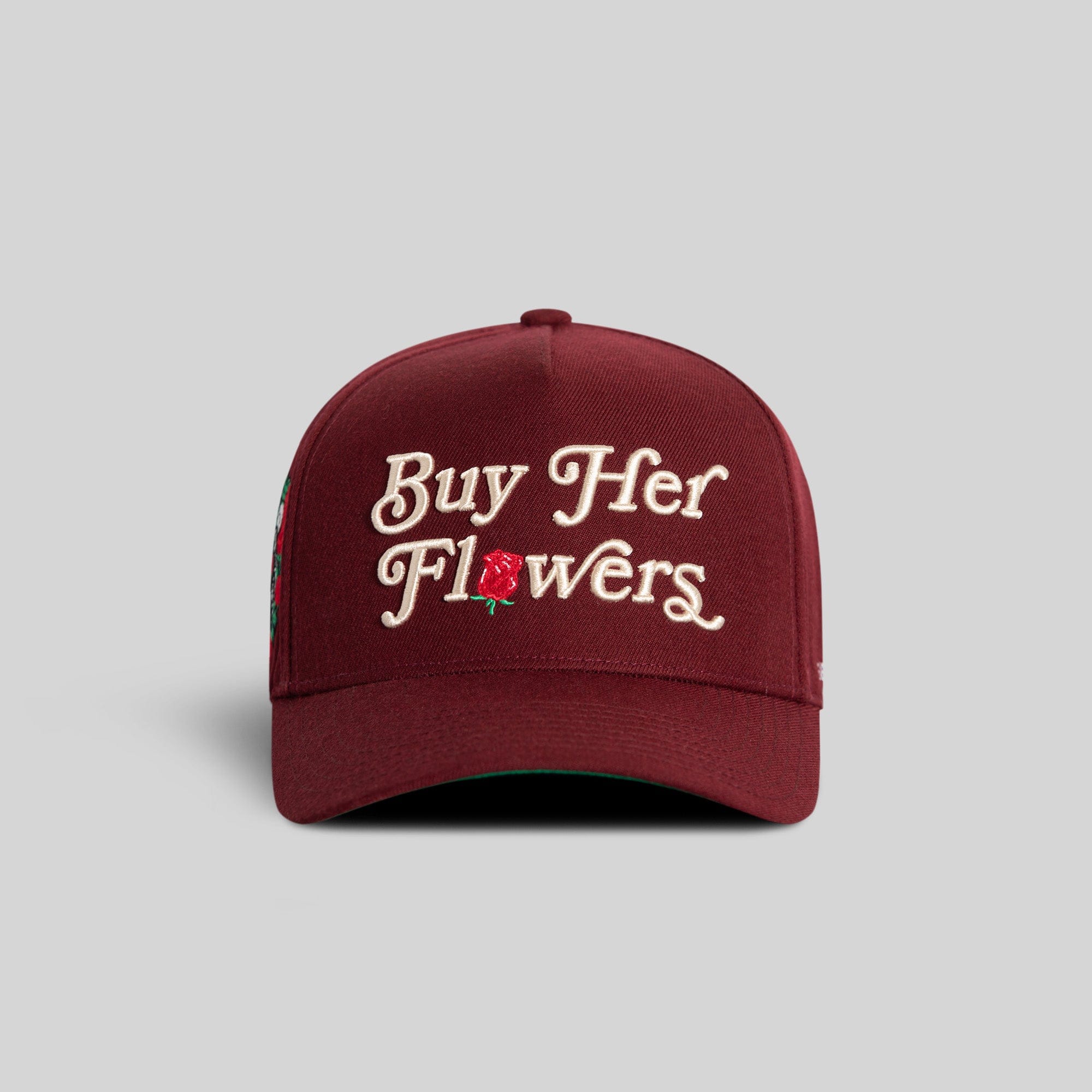 Field Grade Buy Her Flowers Bordeaux wool trucker hat with a structured cap and adjustable strap.