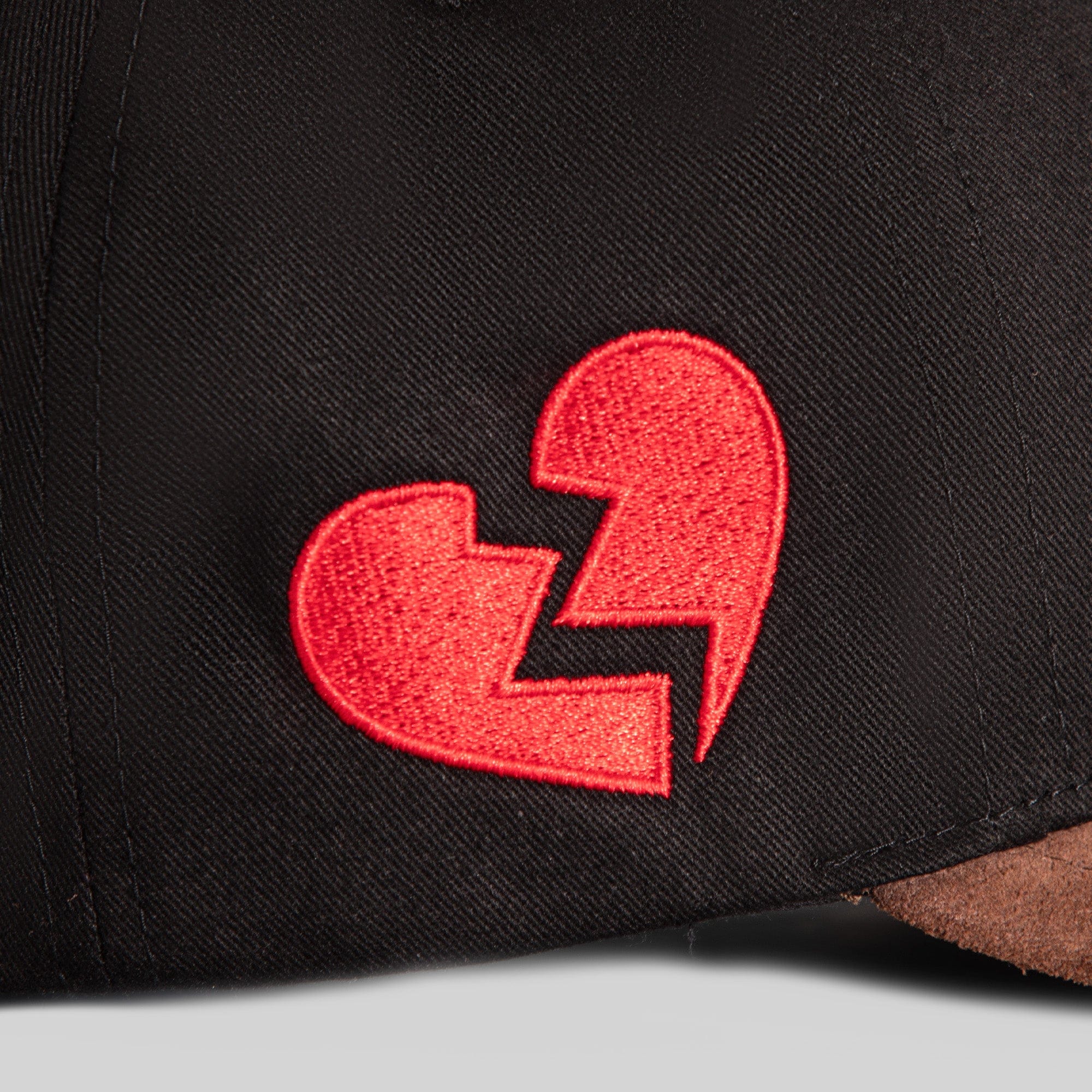 Black mocha twill and suede trucker hat from Field Grade with a casual, stylish design and adjustable mesh back.