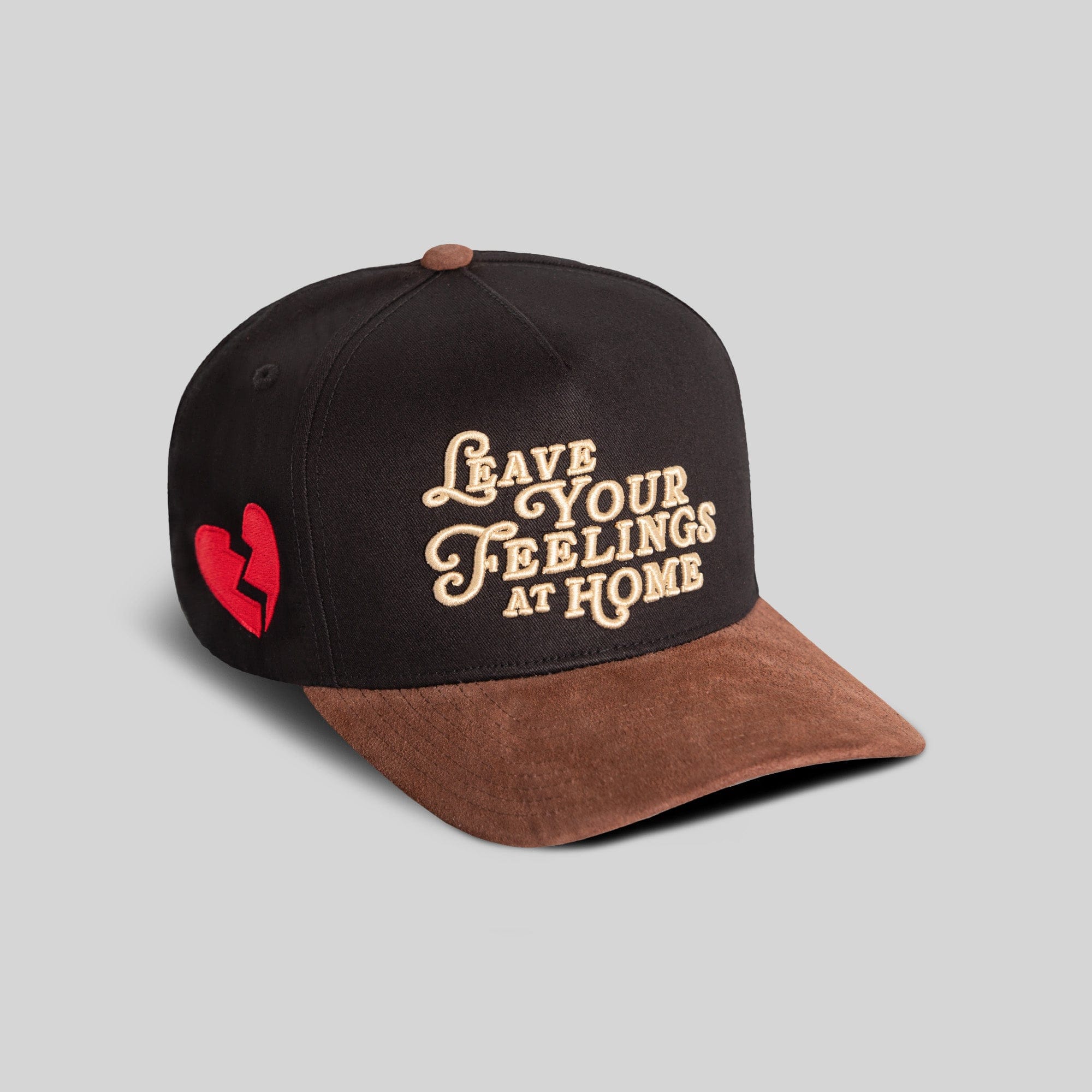 Black mocha twill and suede trucker hat by Field Grade, featuring a classic snapback design and embroidered detailing.