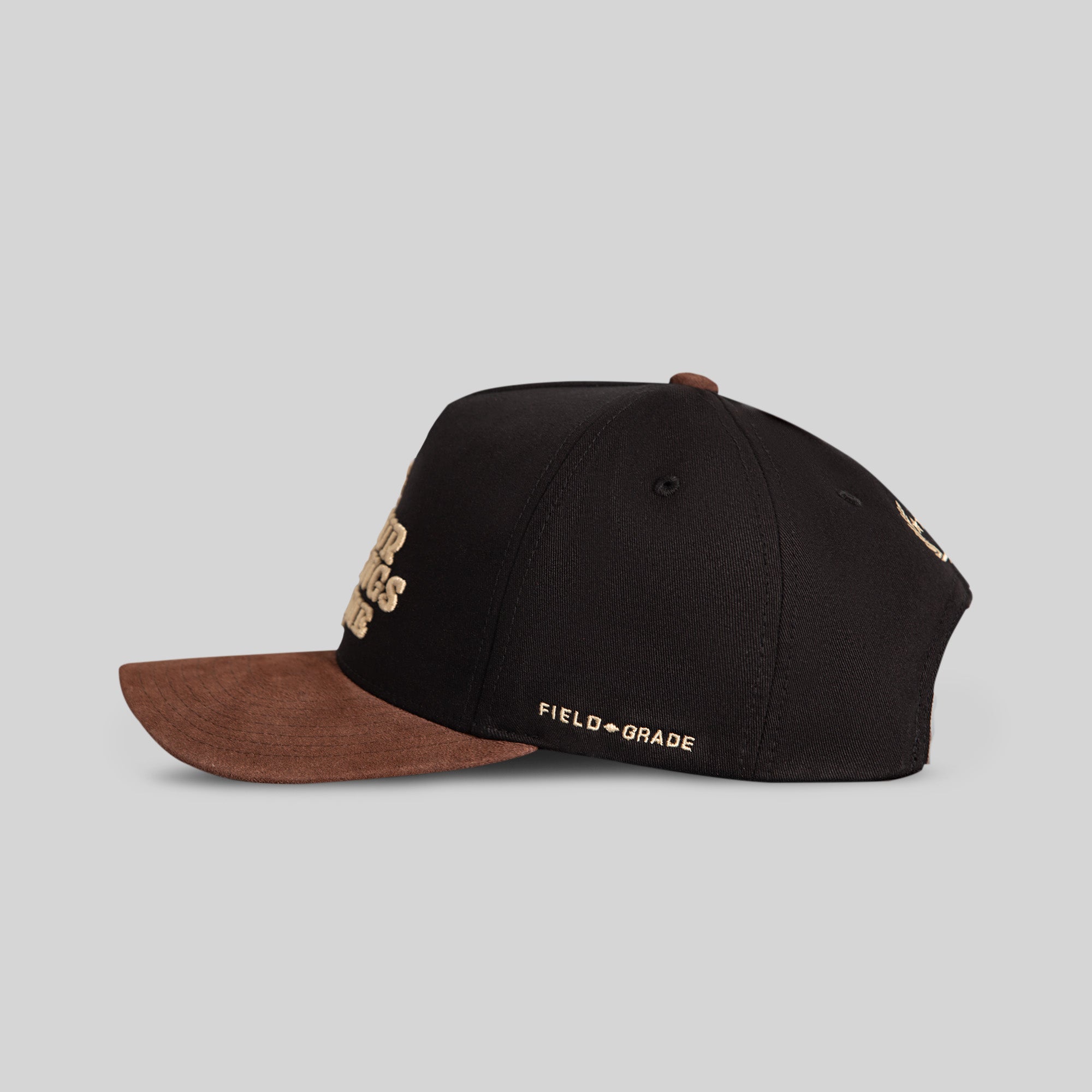 Black mocha twill and suede trucker hat by Field Grade featuring a classic design and adjustable snapback closure.