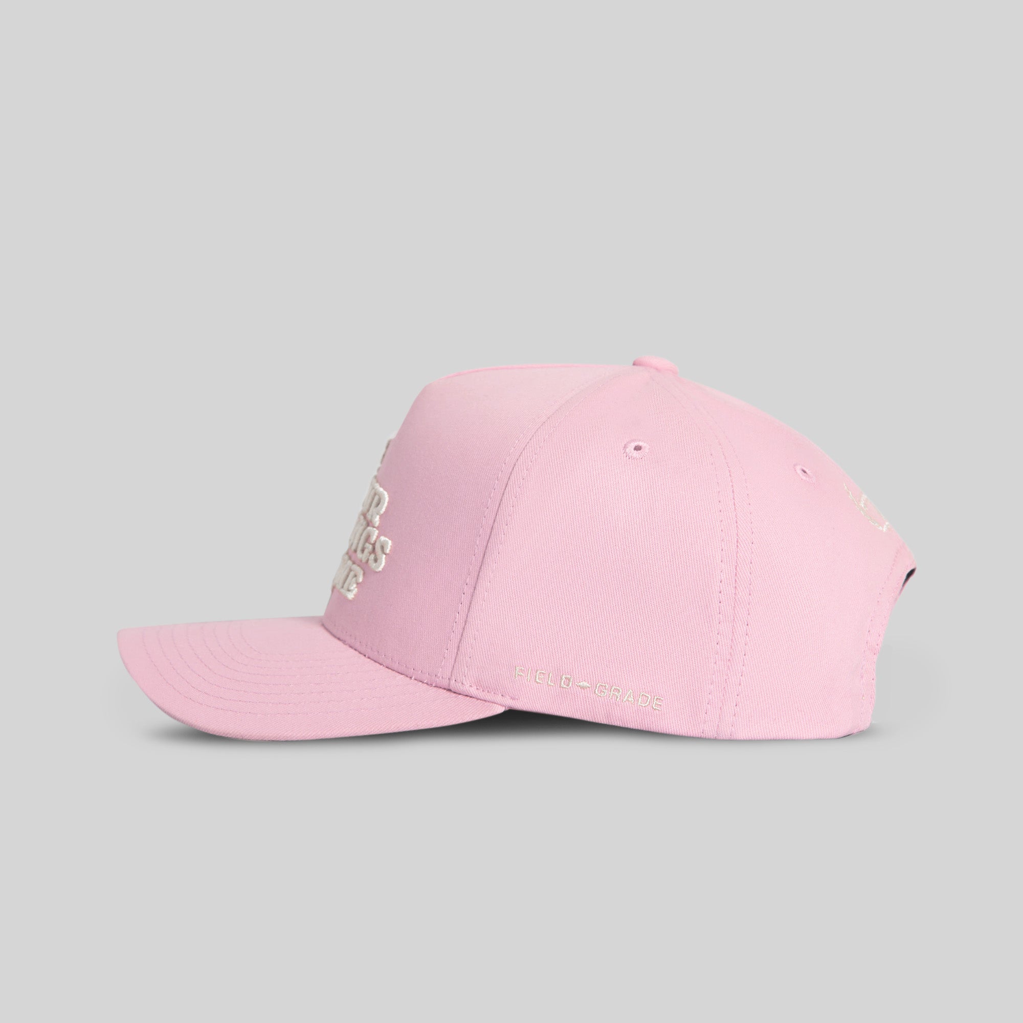 Field Grade Leave Your Feelings Rose Wool Trucker Hat shown from the side, featuring a rose embroidery and classic trucker hat design.