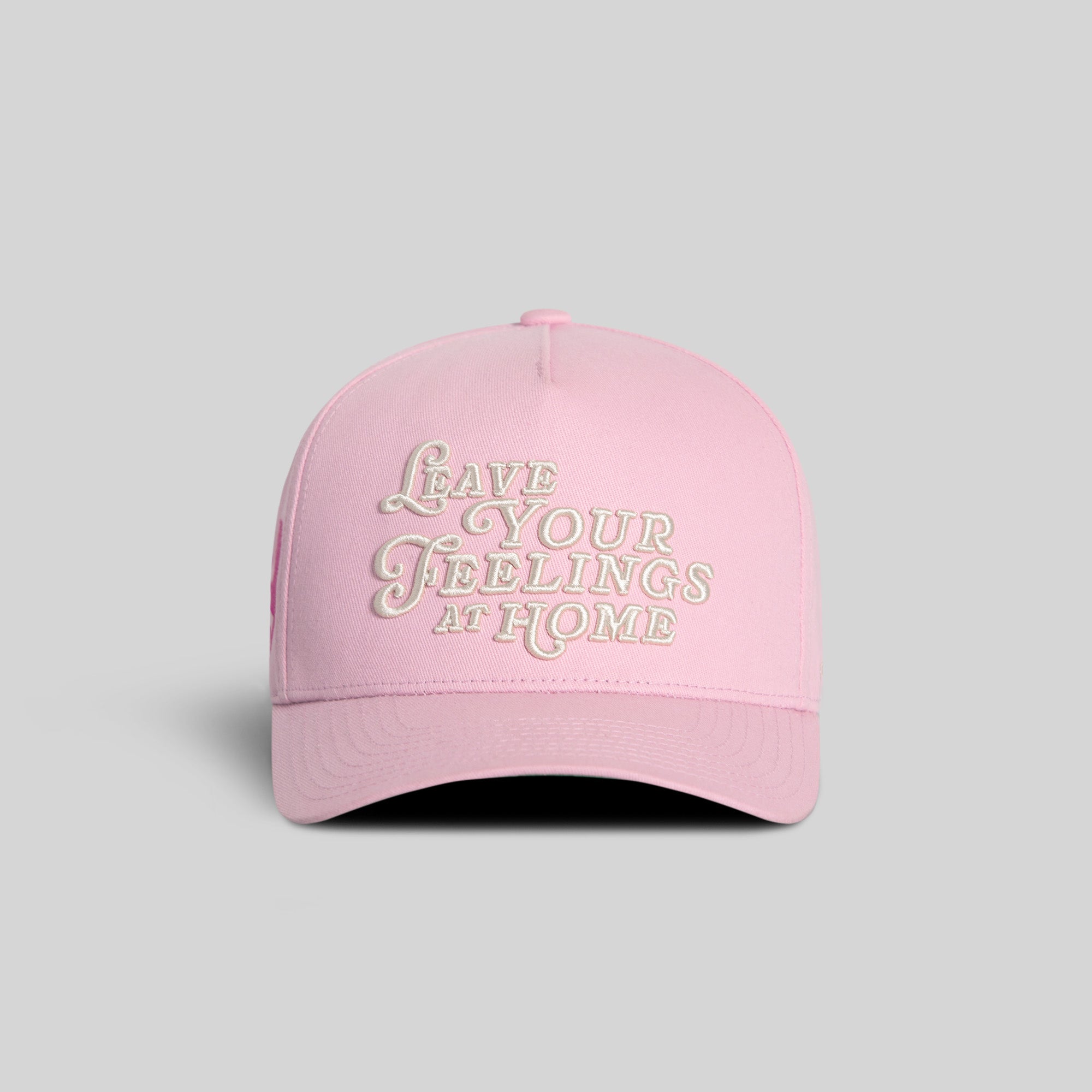 Field Grade Leave Your Feelings Rose Wool Trucker Hat featuring a rose embroidery design on a classic trucker hat style.