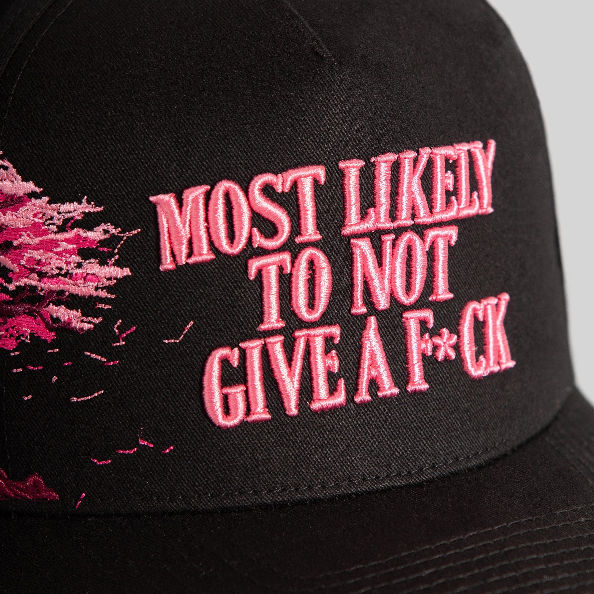 Field Grade cherry blossom black twill trucker hat with curved brim and mesh back, showcasing stylish embroidered design.