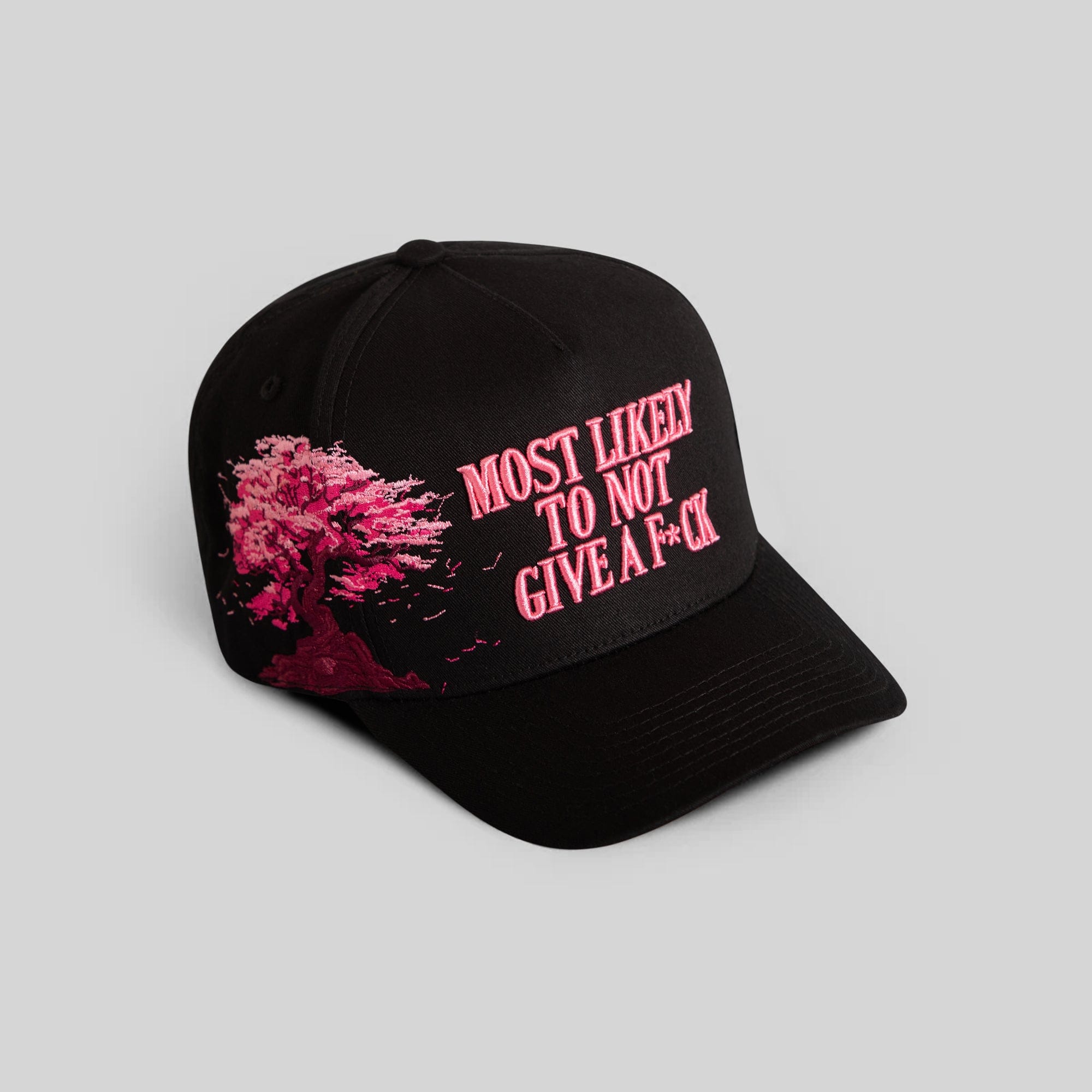 Field Grade cherry blossom black twill trucker hat with adjustable snapback and embroidered front logo.